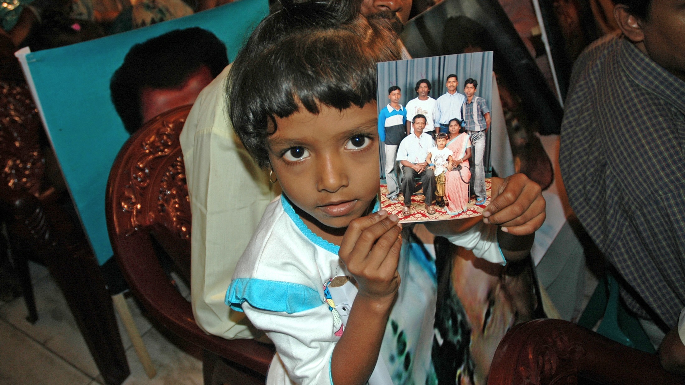 Relatives of missing persons from Sri Lanka's 26-year long civil war hold their pictures during a meeting in Sri Lanka capital Colombo.