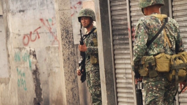 Philippines Zamboanga siege survivors feel forgotten Marines soldiers patrol a community in Zamboanga City. One year after a deadly Muslim rebel siege on the city, the area remains insecure.