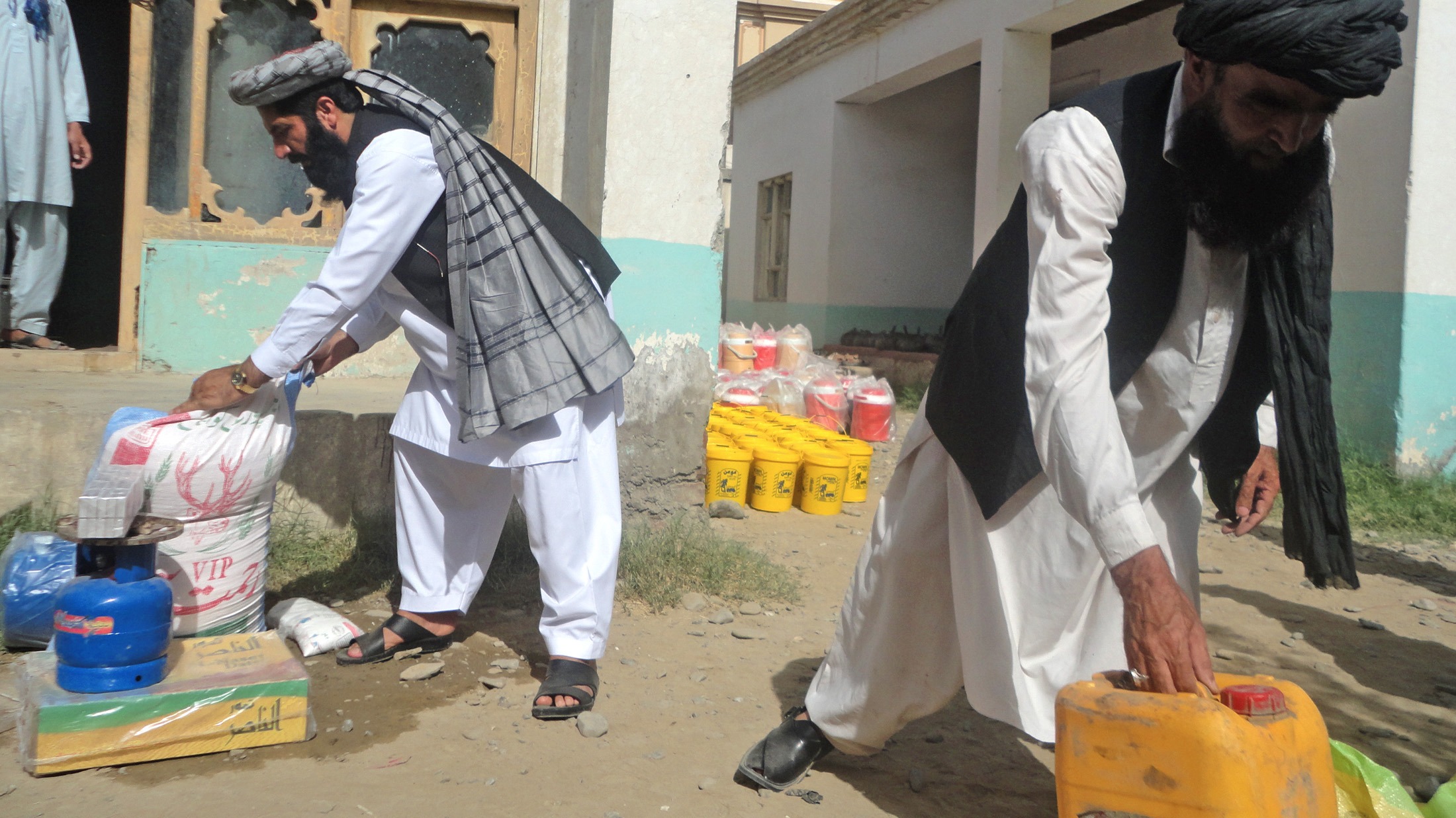 Members of Wazir tribes from North Waziristan after getting food items in Khost, Afghanistan