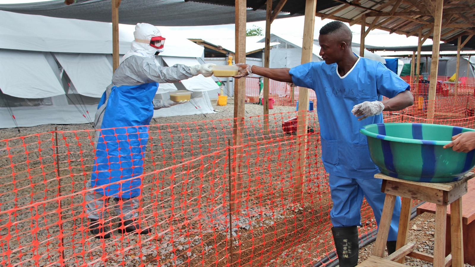 Health workers at the IFRC Ebola treatment centre outside of Kenema serve staff breakfast: WFP-provided CSB. (October 2014)