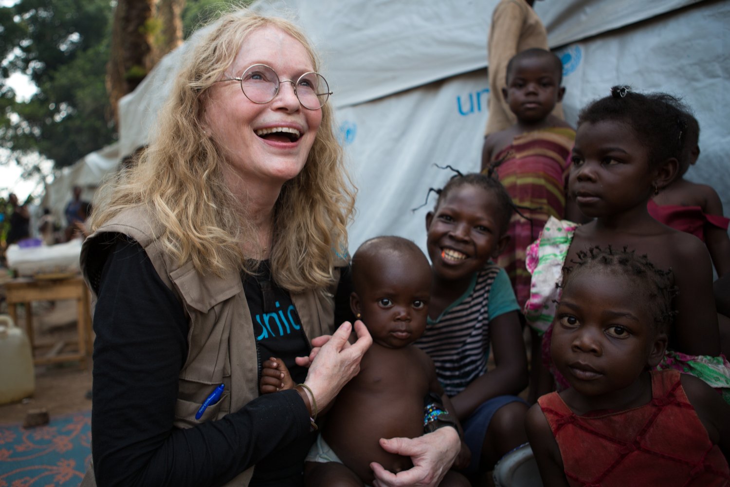 On 2 July 2015, UNICEF Goodwill Ambassador Mia Farrow greets internally displaced people (IDPs) in the Central African Republic (CAR), specifically  the St. Michel displacement site near the southern town of Boda in Lobaye Prefecture.