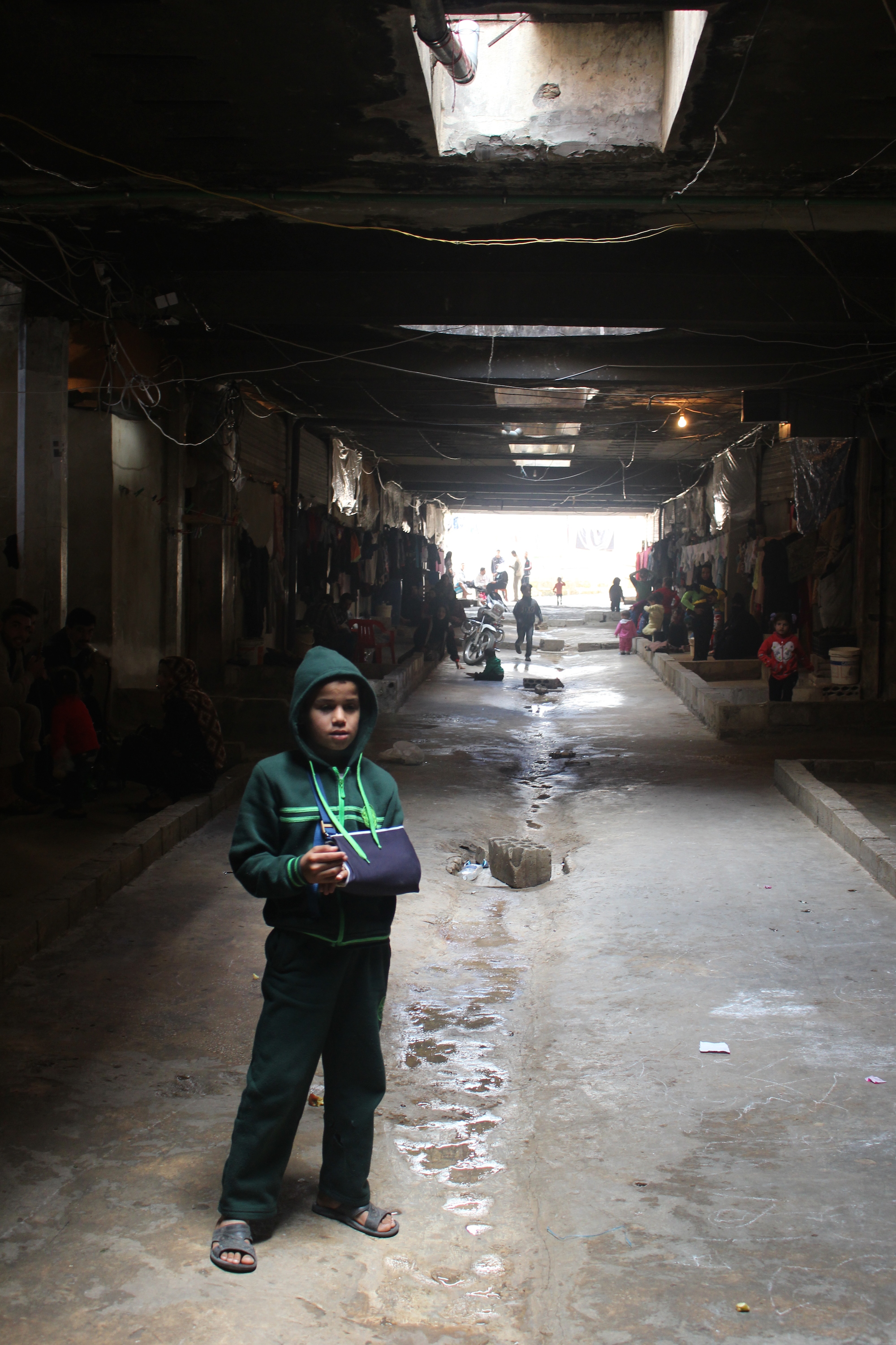 Around 850 Syrian refugees are living in an abandoned car park near the southern Lebanese city of Saida