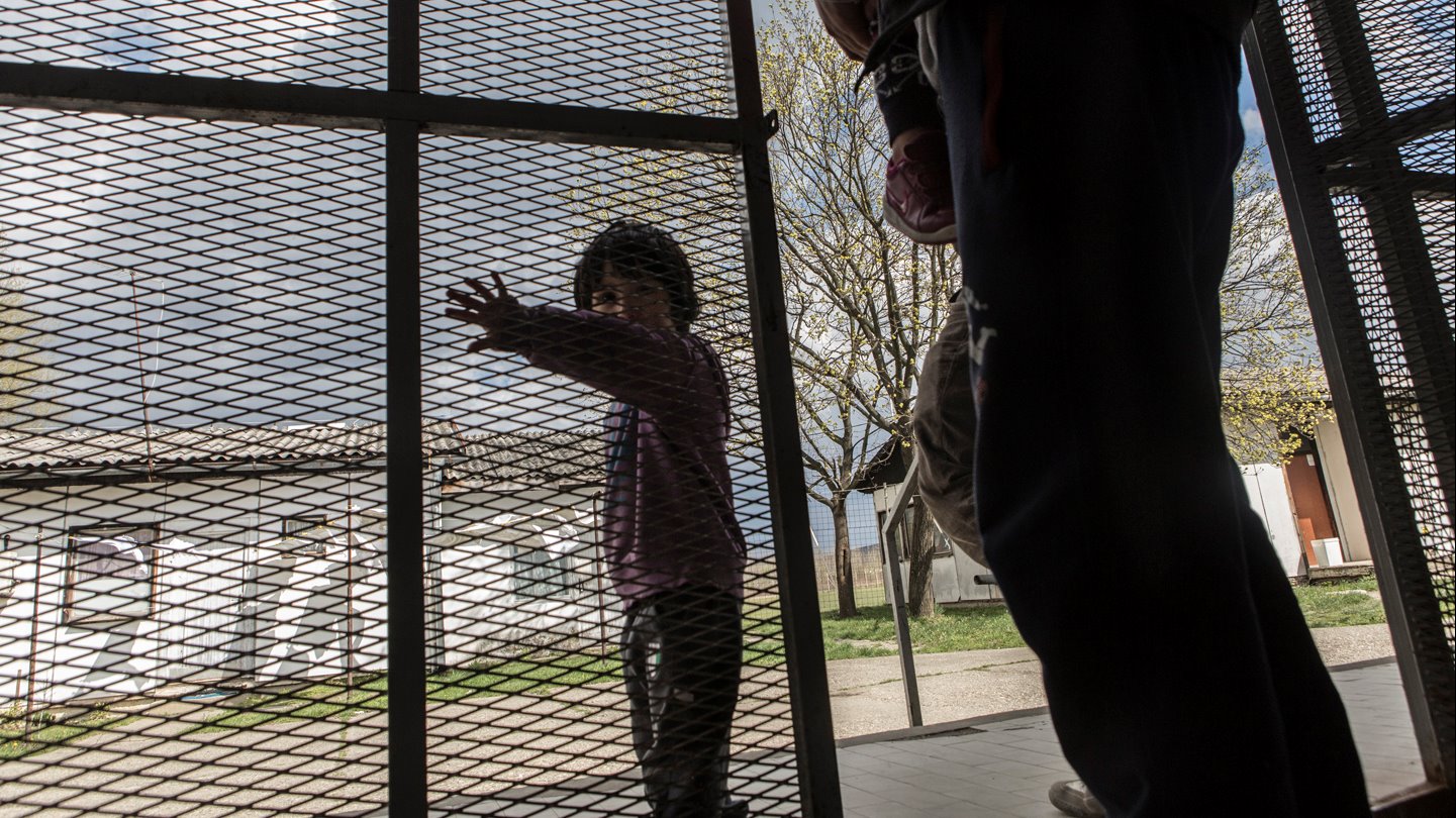 A Syrian child at the entrance to the Krynjaca asylum centre in Belgrade, Serbia.