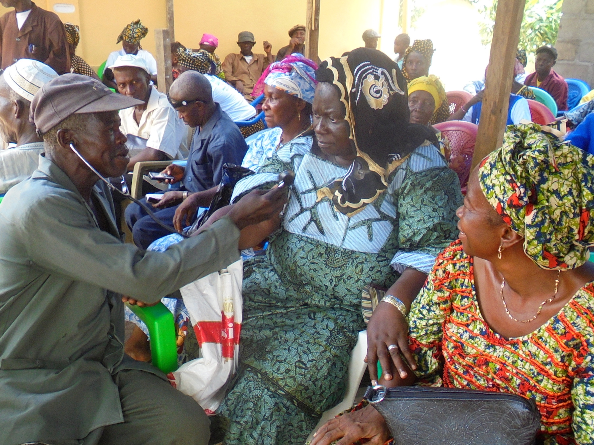 Some Guineans waited a year to bury their Ebola dead because of local customs and government restrictions on public gatherings. As part of traditional rituals, friends and family impersonate the career or characteristics of someone who died. In this case,