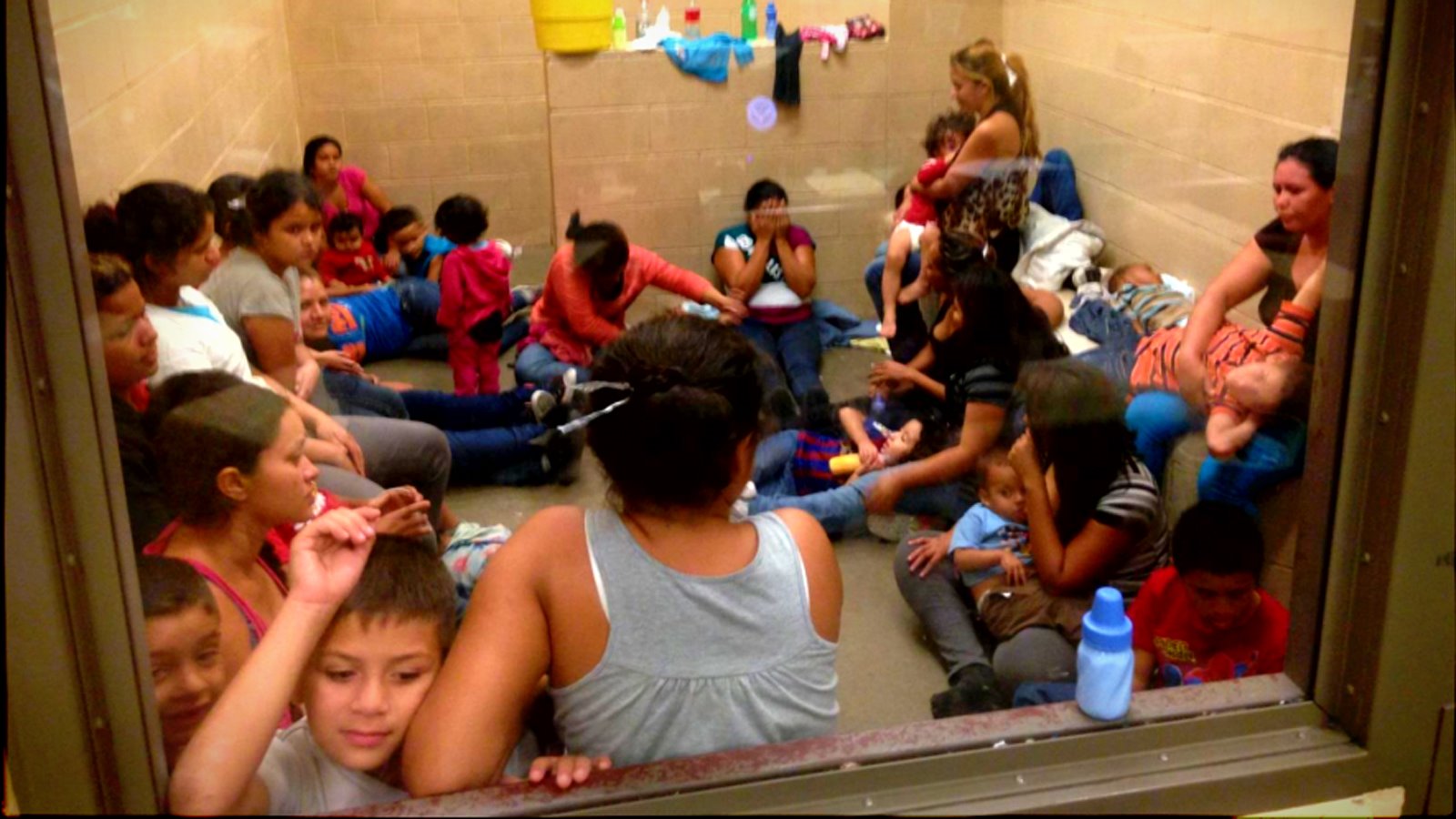 Migrants, among them many women and children, detained at a border patrol station in Texas, United States