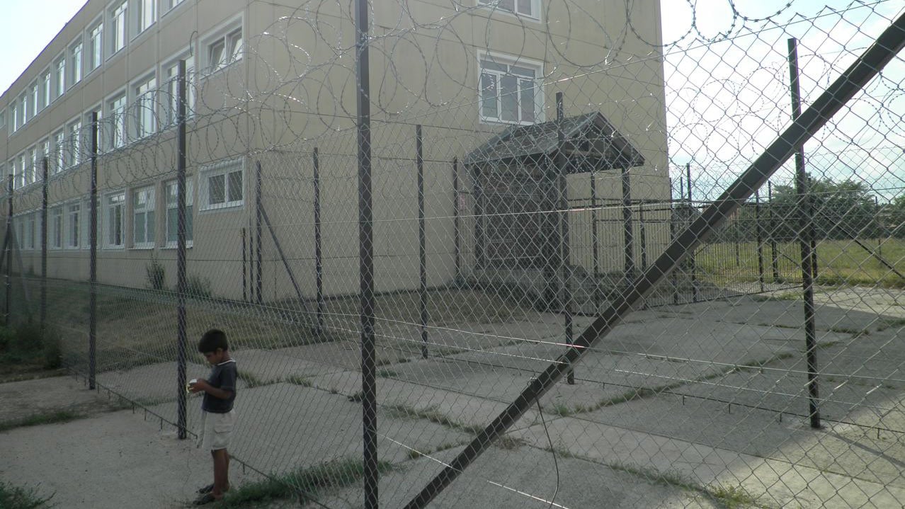 Razor wire surrounds Debrecen centre for asylum seekers in eastern Hungary. Parts of the centre are "open" but the facility also contains a unit for detaining asylum seekers considered at risk of absconding. 