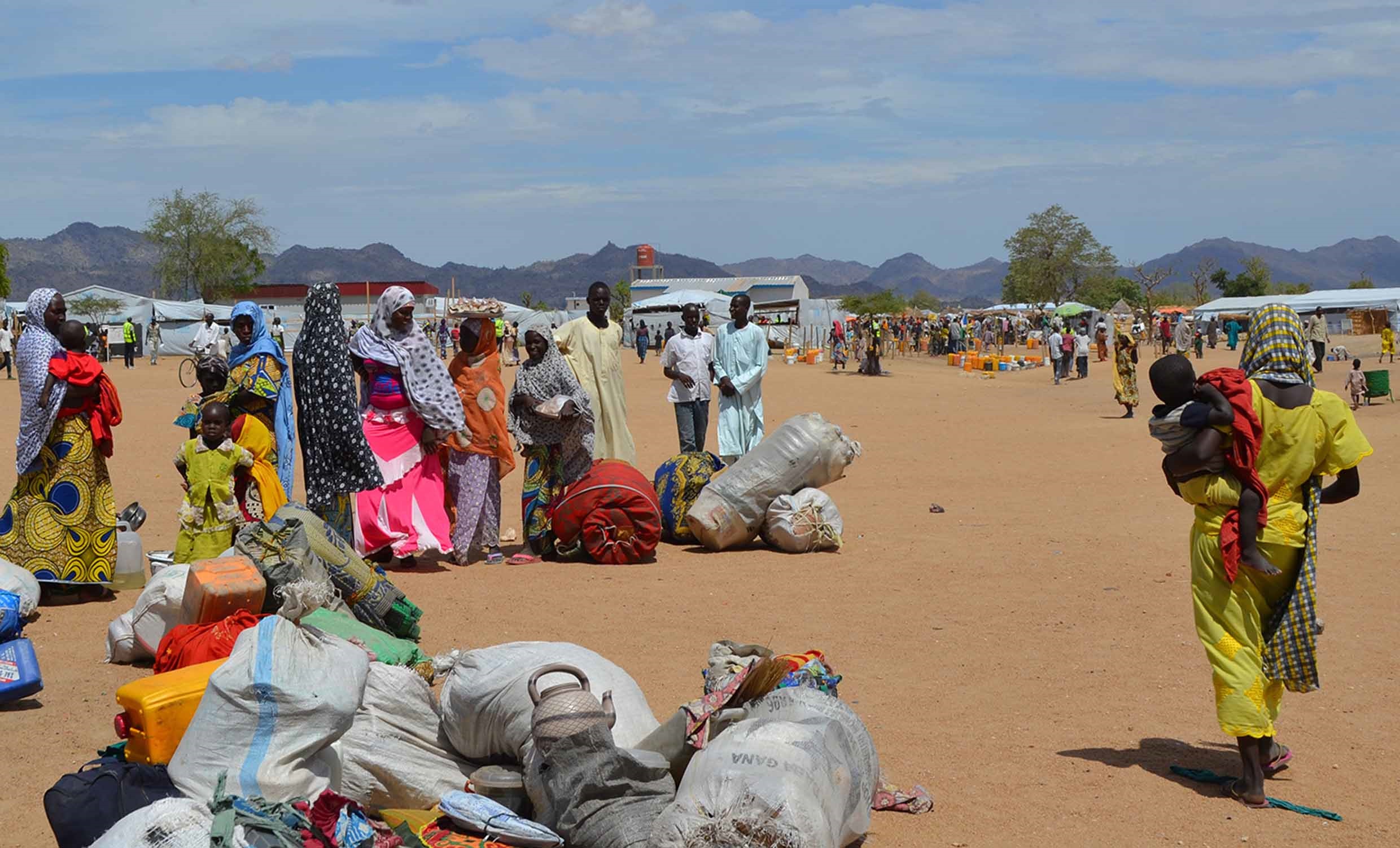 Nigerian refugees fleeing Boko Haram wait to be registered outside the Minawao camp, after arriving in northern Cameroon - August 2015