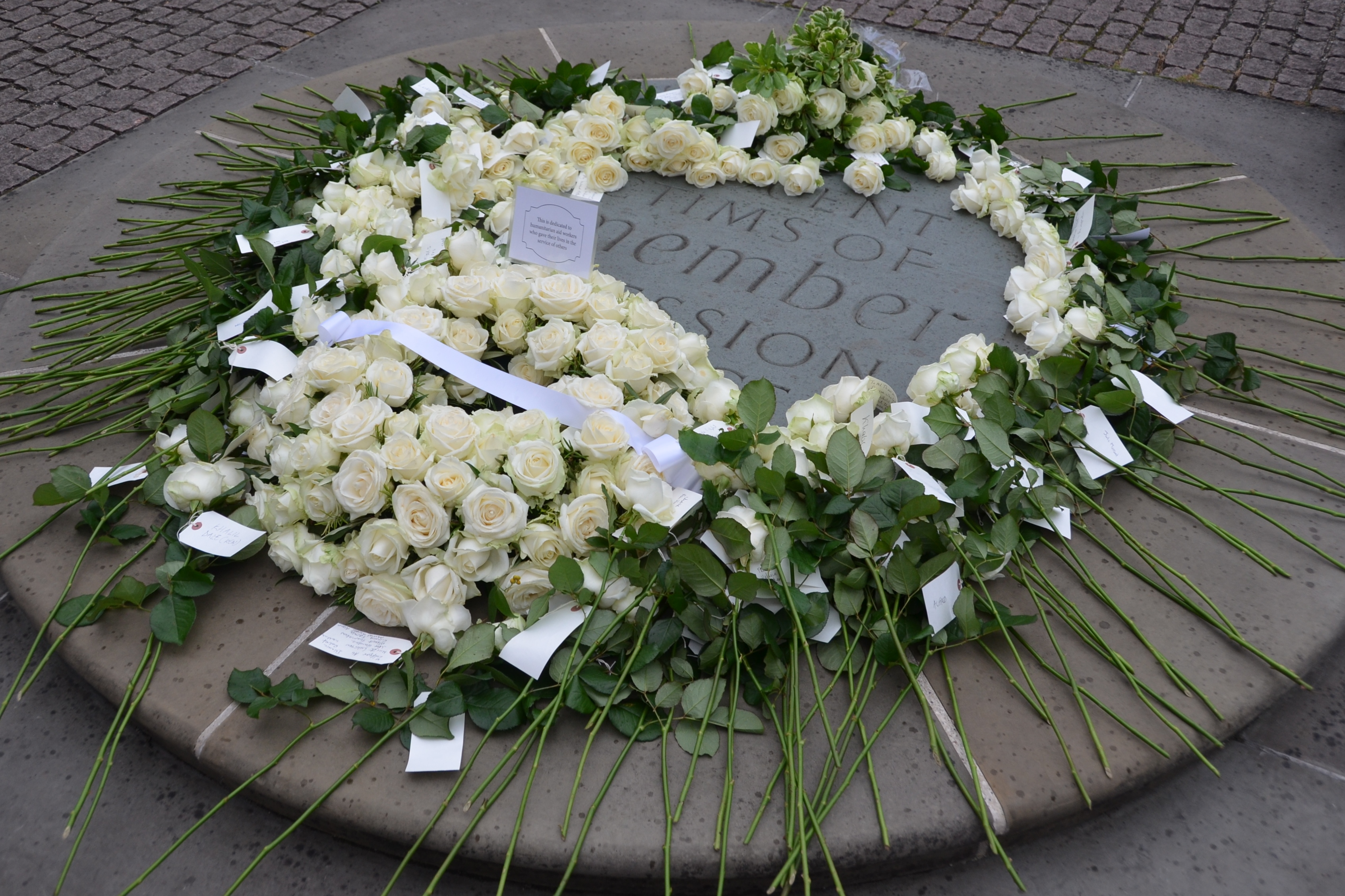 Flowers laid outside Westminister Abbey in London, United Kingdom during a memorial on 18 August 2015 for humanitarian aid workers killed in the course of their work. The commemoration, the second of its kind in the UK, fell the day before World Humanitar