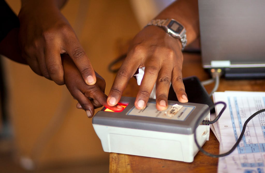 A member of a recently arrived Somali family is fingerprinted by UNHCR staff during the registration at a transit center in Dolo Ado, Ethiopia