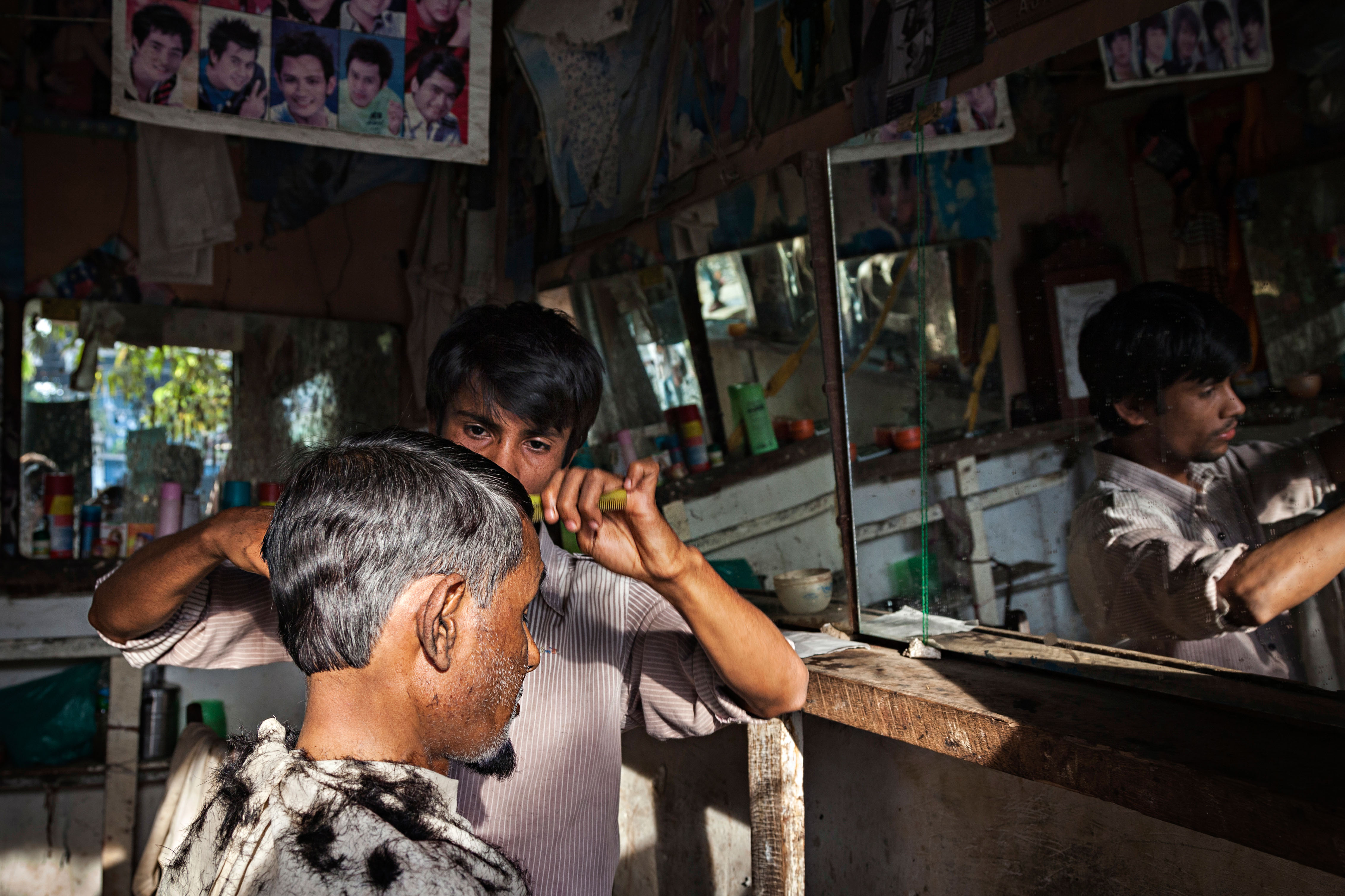 A Rohingya man gets his hair cut in the main market in Buthidaung township in the western Rakhine State in early 2014 A Rohingya man gets his hair cut in the main market in Buthidaung, a township in Myanmar's western Rakhine State in early 2014.