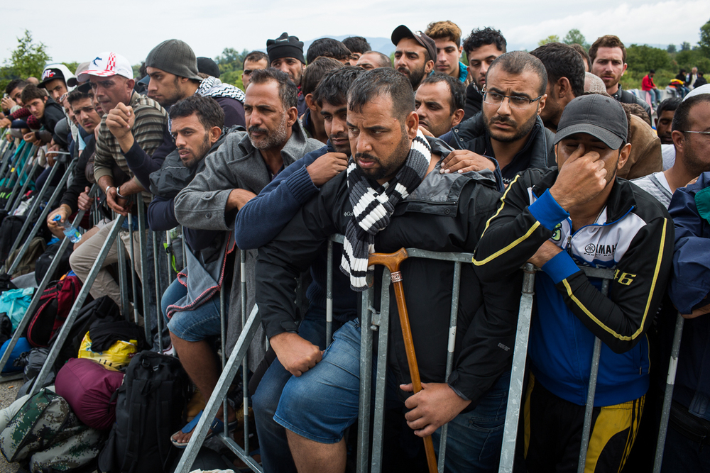 Having made it to Croatia's border, refugees have another long wait for a bus to take them into Slovenia. Buses arrive every two hours and take only about 50 people at a time.