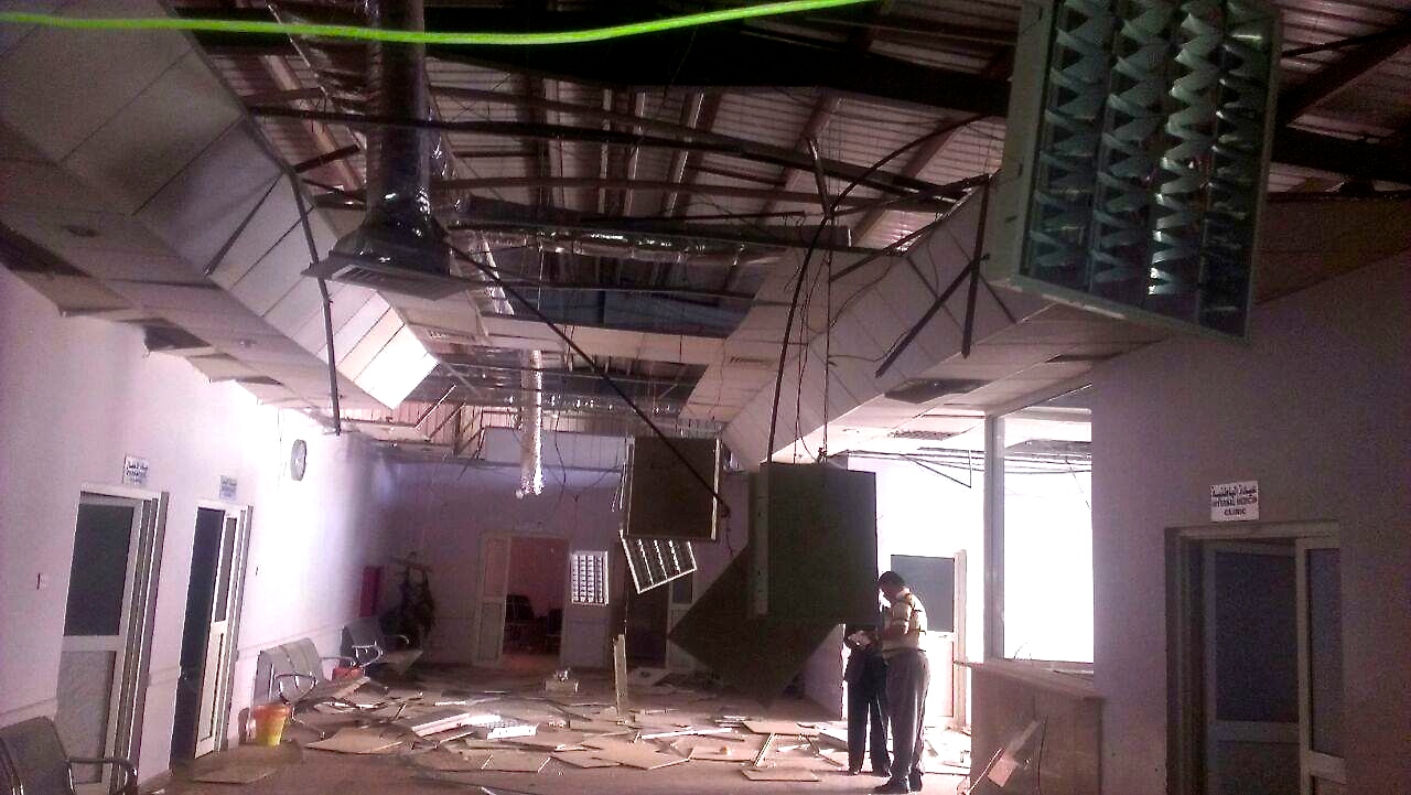 Staff inspect the Military Hospital in Sana'a after it was hit by an airstrike by the Saudi Arabia-led coalition. 