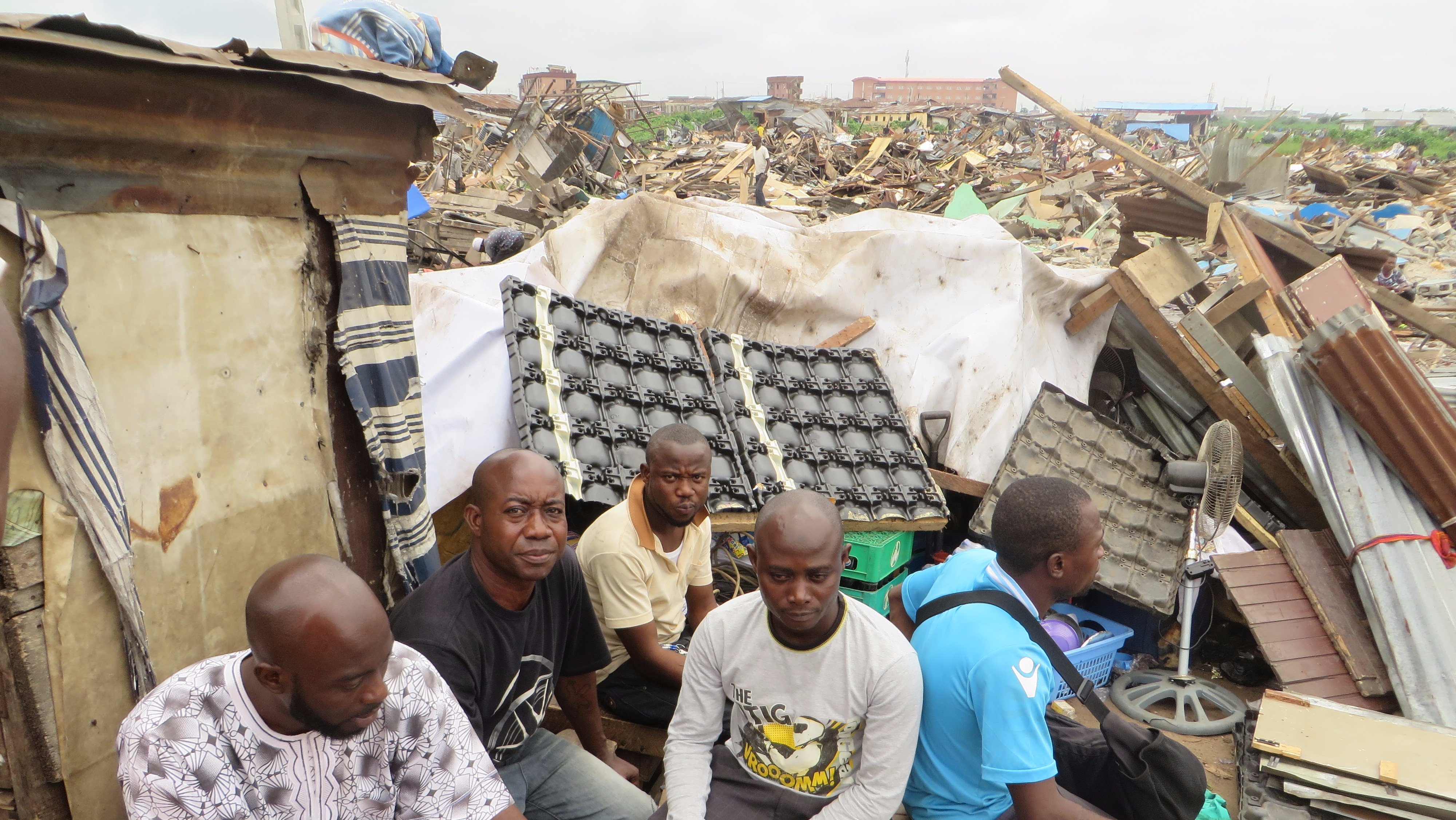 With nowhere to go, many people still remain in Lagos' Badia East amidst the ruins of their demolished houses. (October 2015)