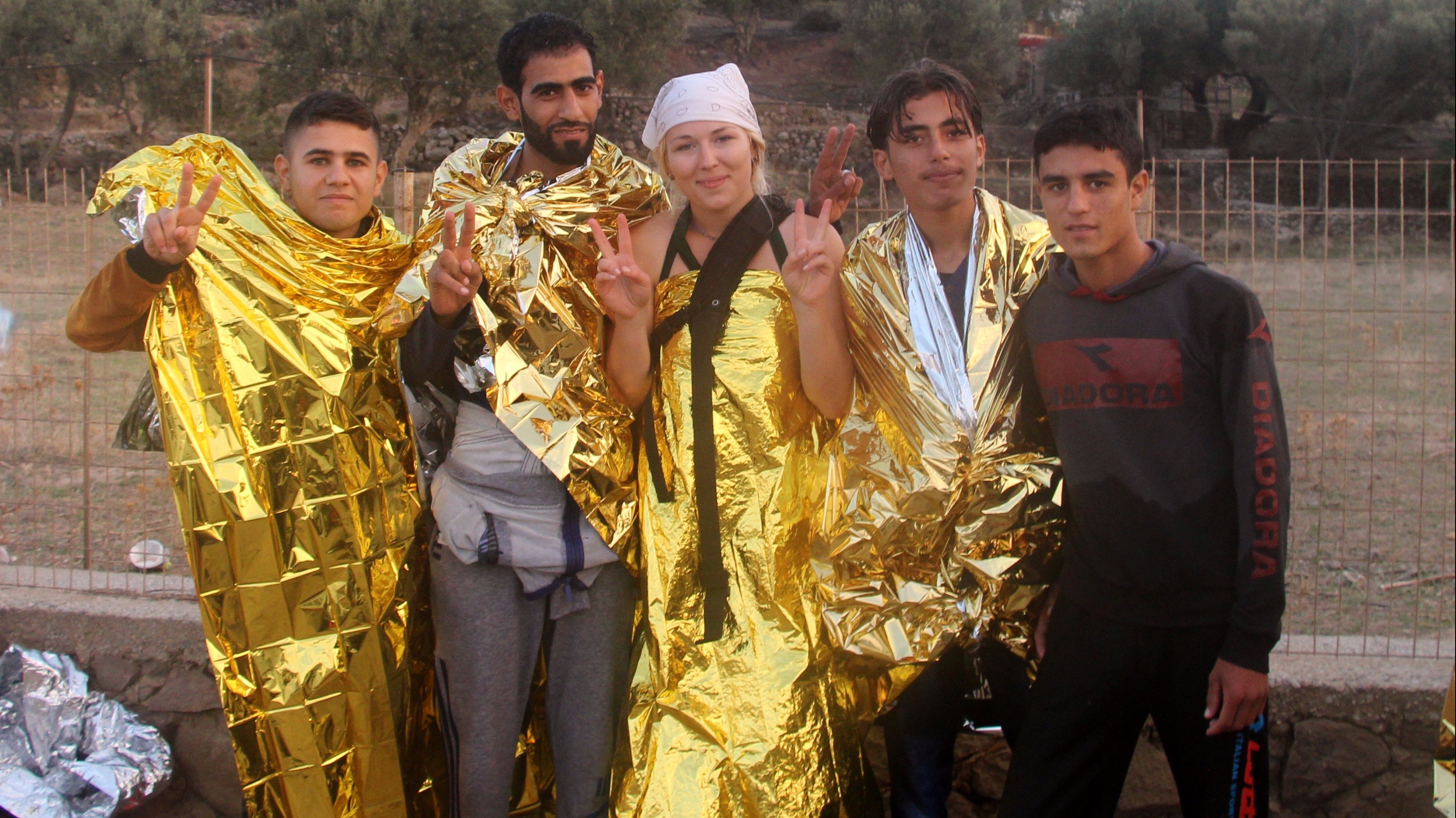 Marienna with some of the refugees she helped from their boat on her first day of volunteering on Lesvos