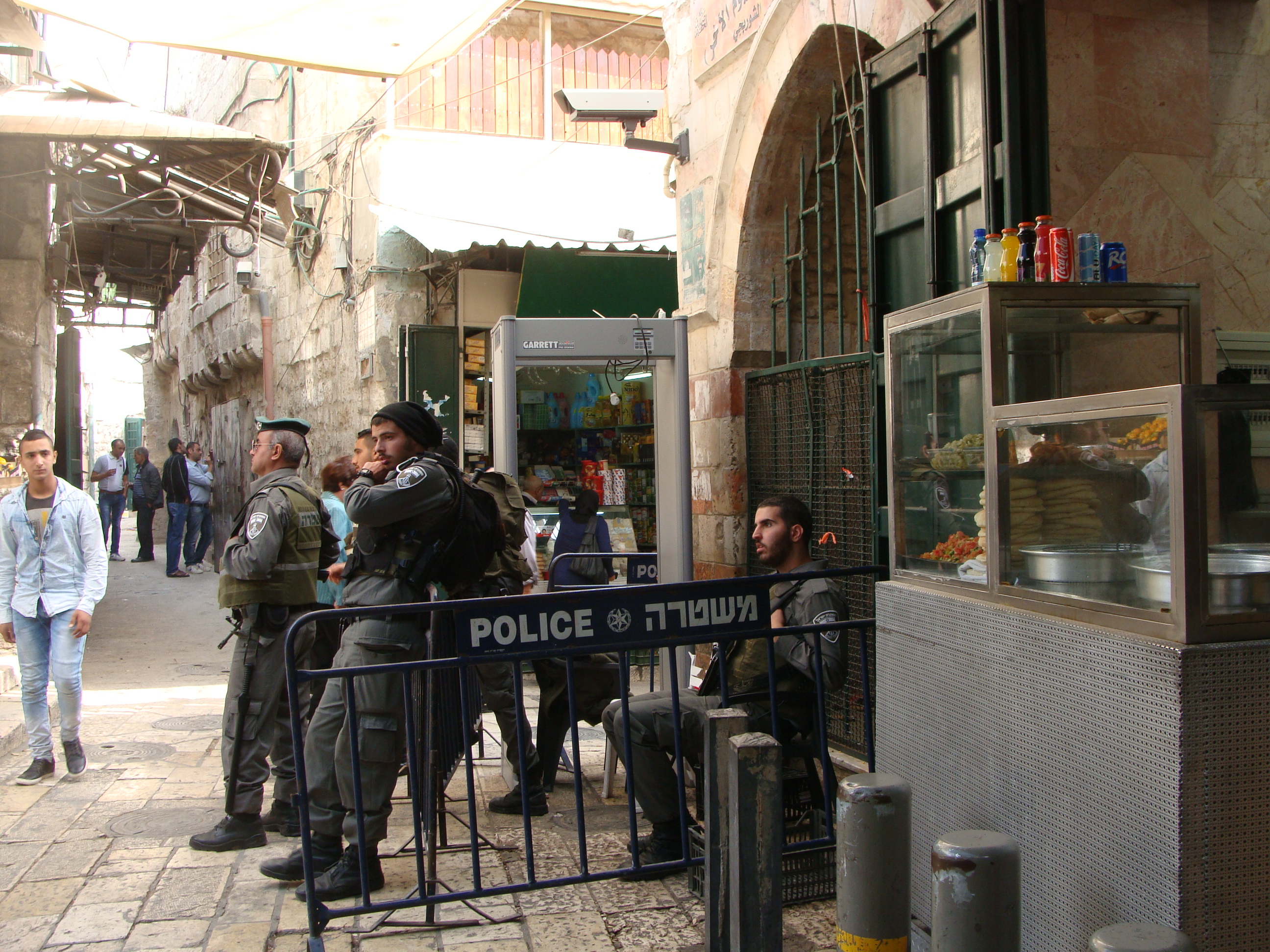 Israeli forces and a newly installed metal detector on the corner of Al Wad Street, in Jerusalem's Old City. 
