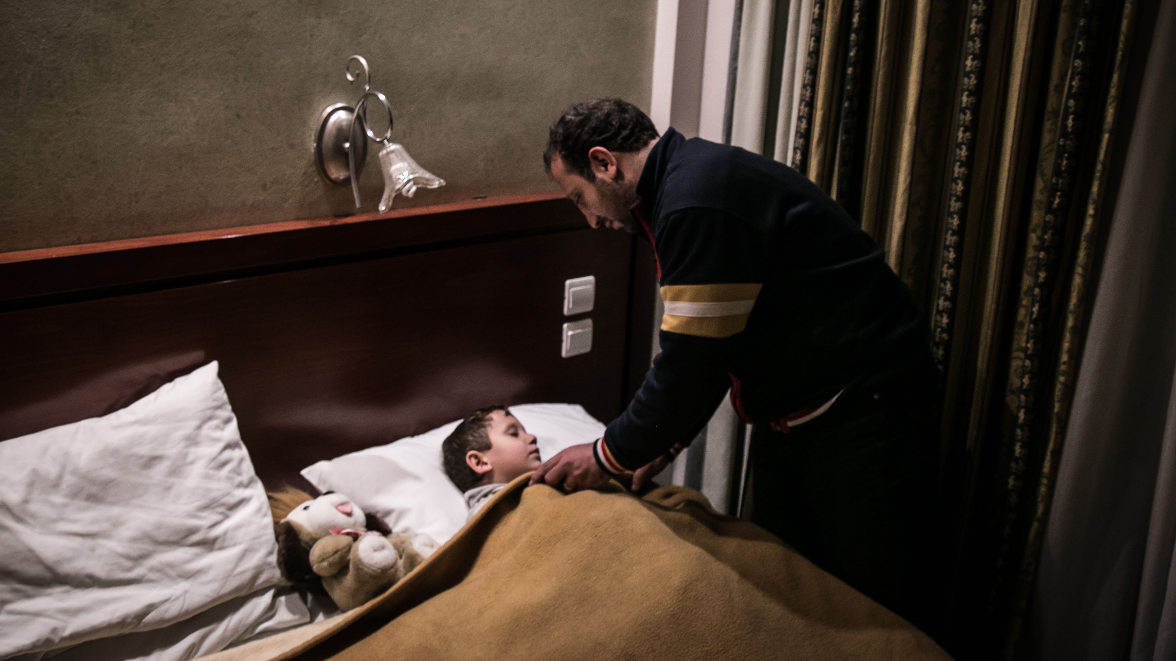 Maher Dahood, who lost his wife and two daughters on the boat trip to Greece, is now the sole carer of his three-year-old son. They are waiting to be relocated from Greece in an Athens hotel.