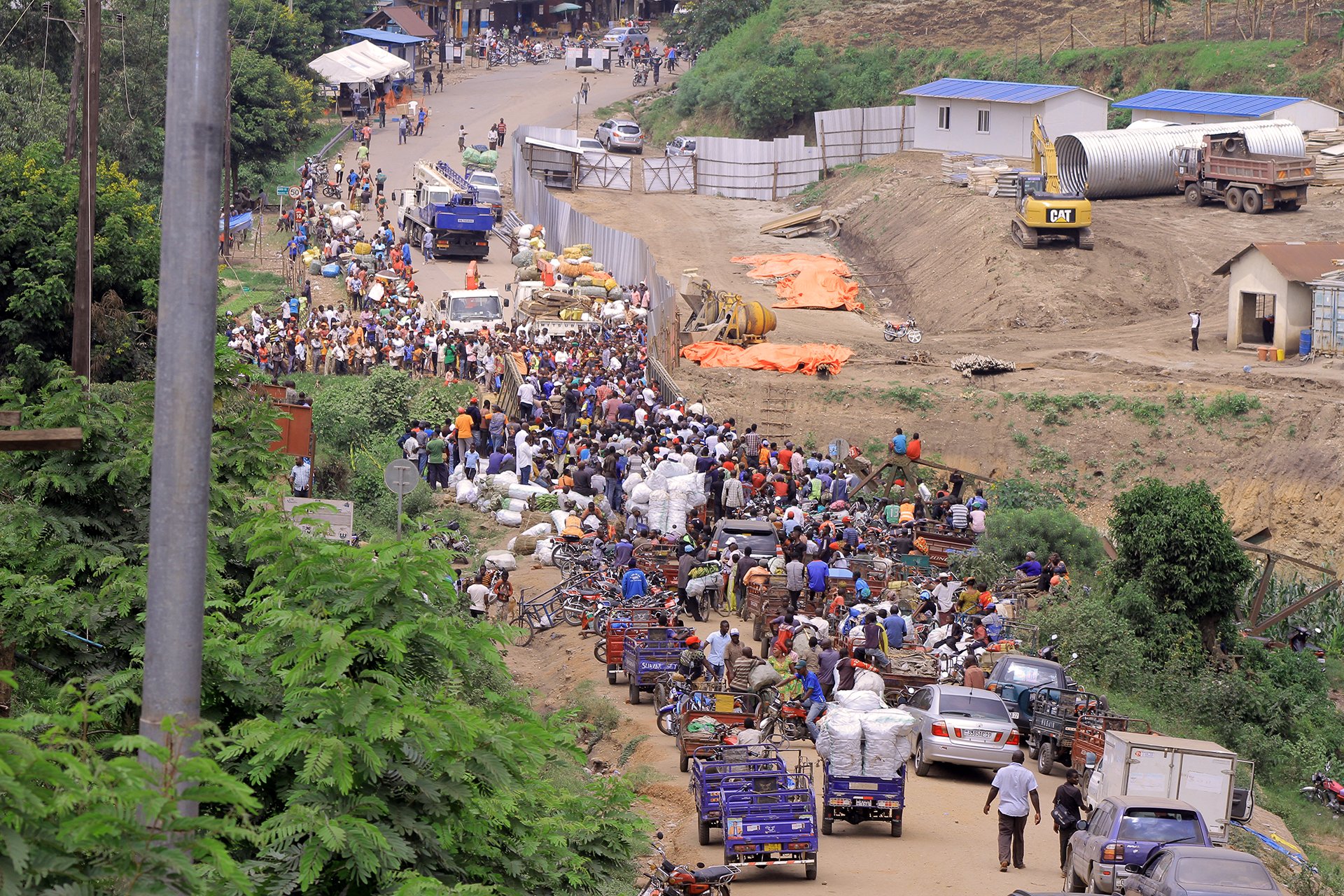 A lot of people crowd a road