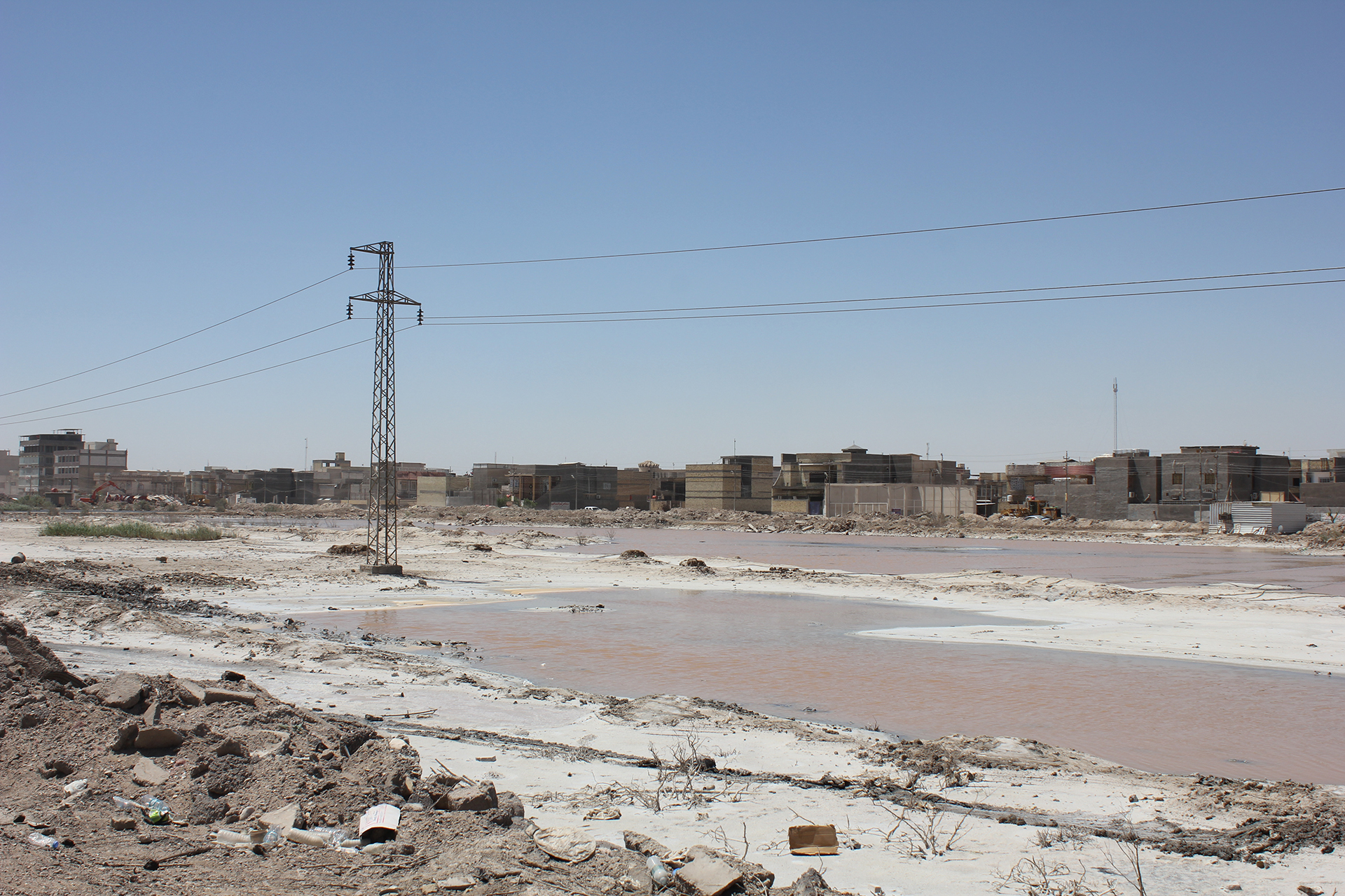 Stagnant pools of water in Basra's al-Abbas district