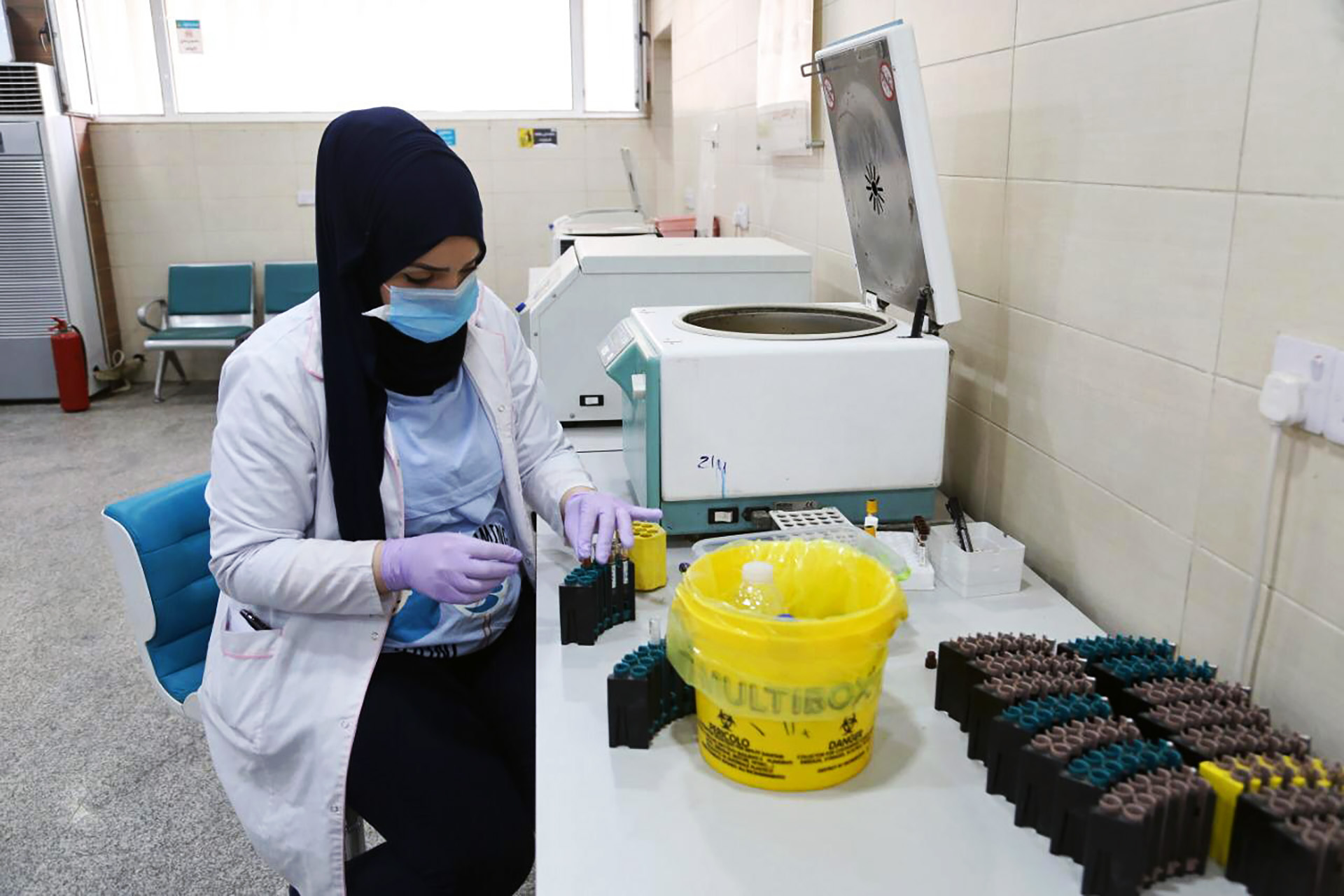 A doctor at Baghdad’s Medical City health complex analyses COVID-19 test results, on 1 August 2021.