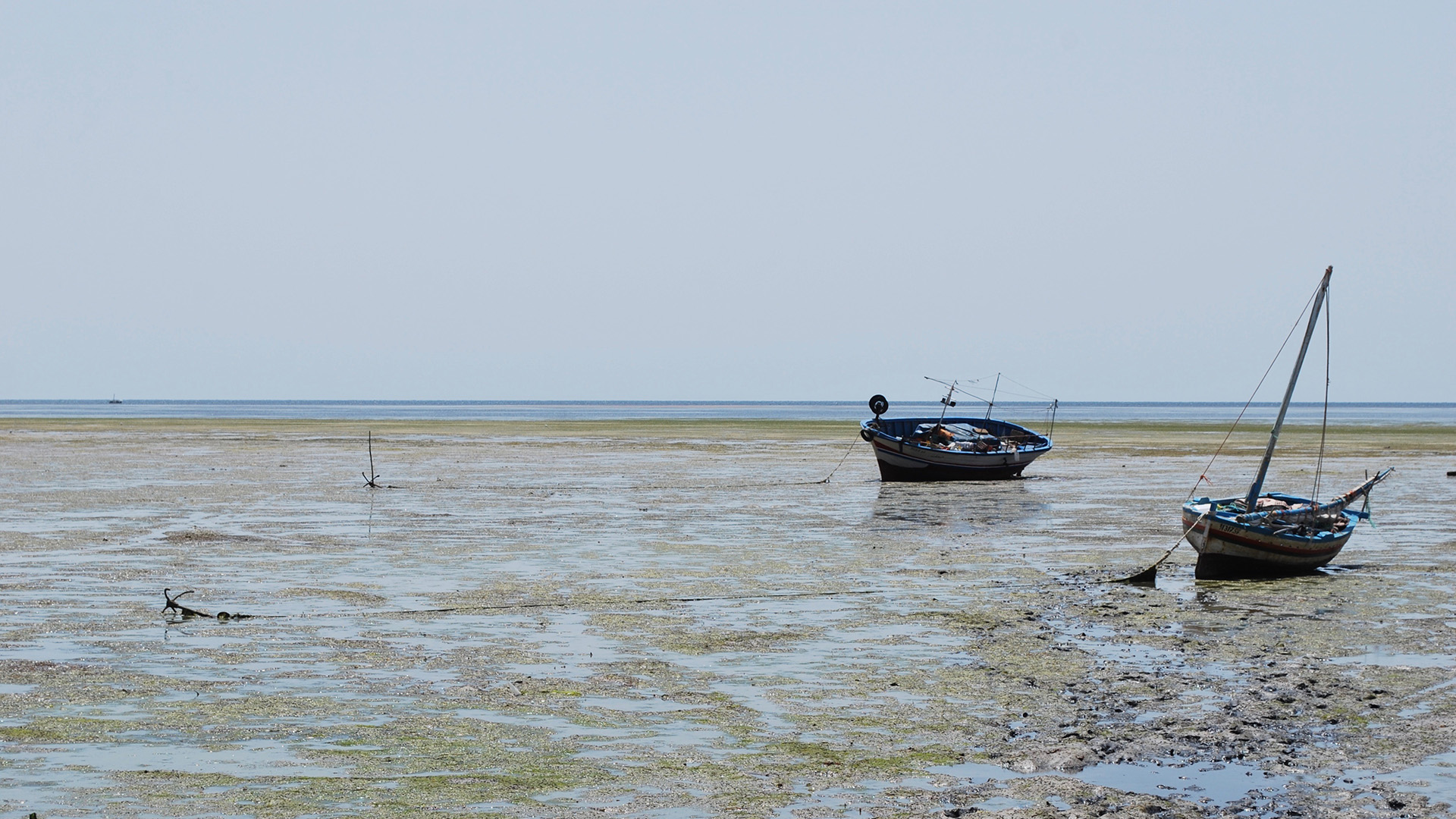 Boats rest on the sand on the Mahrès seafront