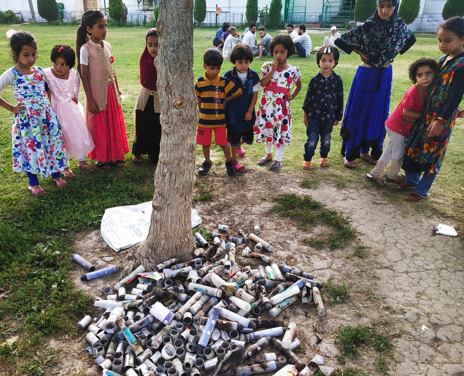 Children look at tear gas canisters fired by security forces to disperse anti-government protestors in Srinagar in September 2019, a month after Indian authorities put Kashmir on lockdown.