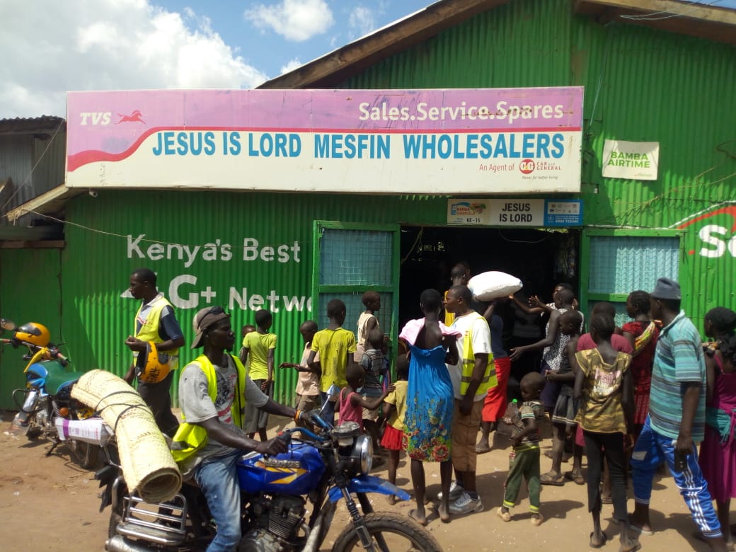 Customers gather at a shop in Kakuma