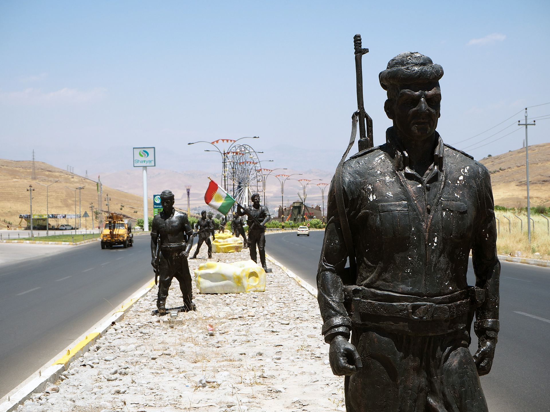 Kurdish Peshmerga statues in the middle of the highway leading to the town of Zakho.