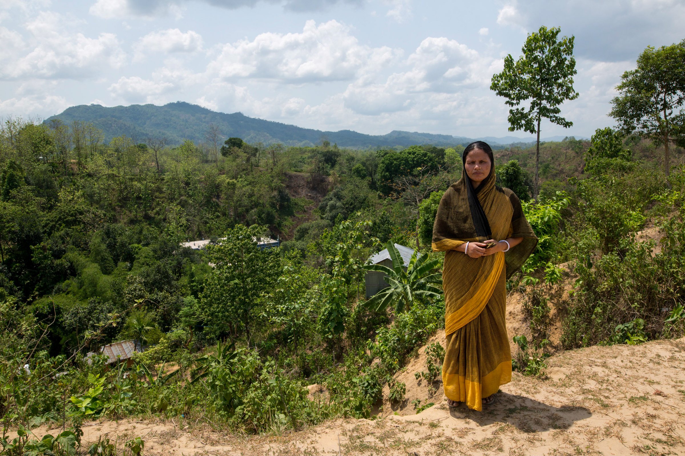 Photo of woman on hill in Bangladesh landslide prone area