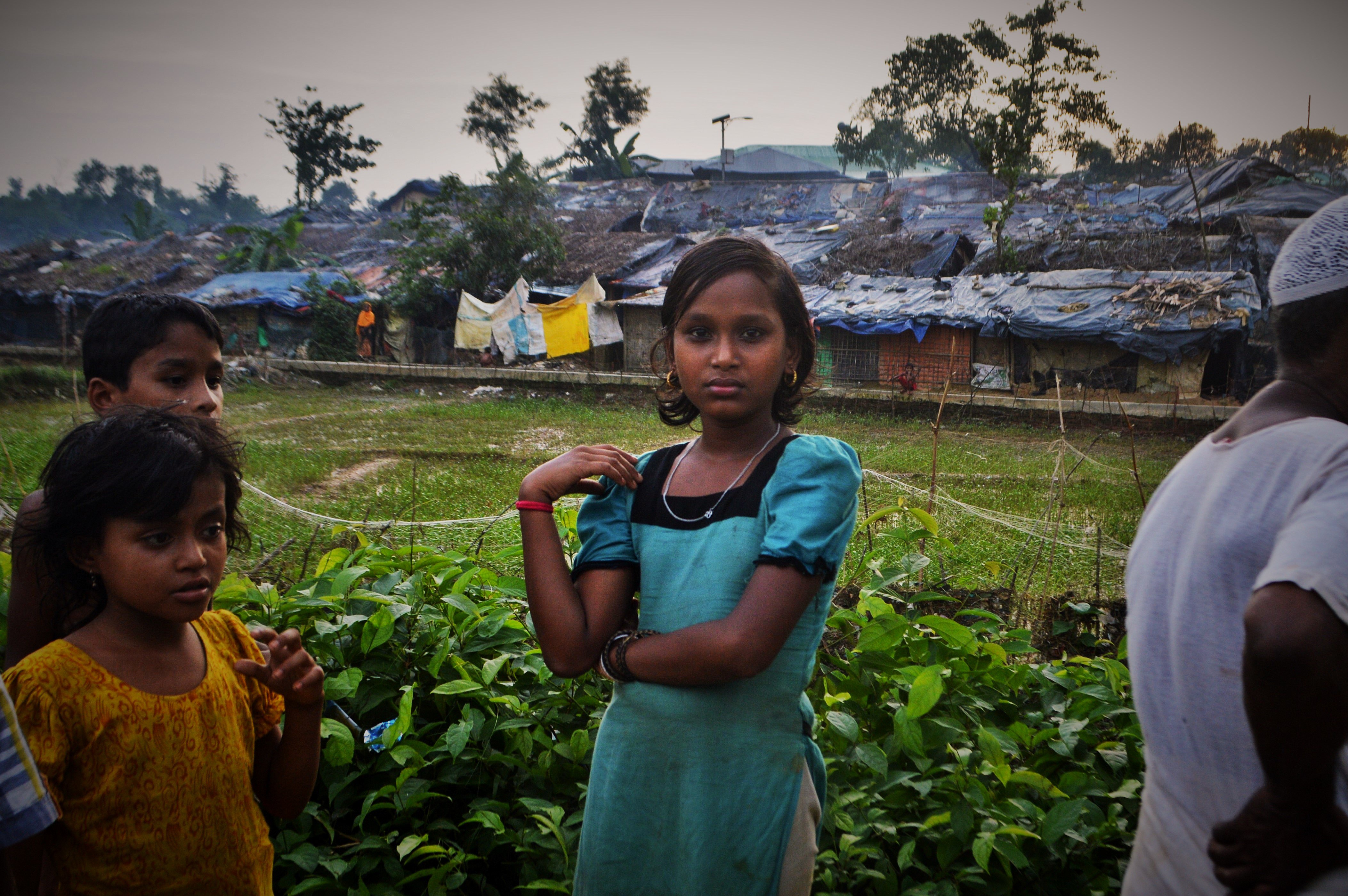 Rohingya refugee children from Myanmar stand outside Kutupalong camp in Bangladesh.