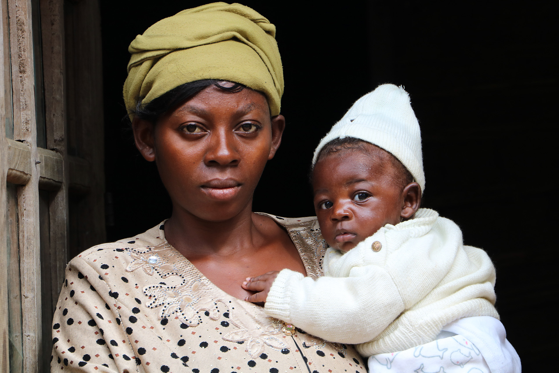 Ebola survivor Rachel Kavughokahuko nurses her two-month old son in her house in Congo's town of Beni.