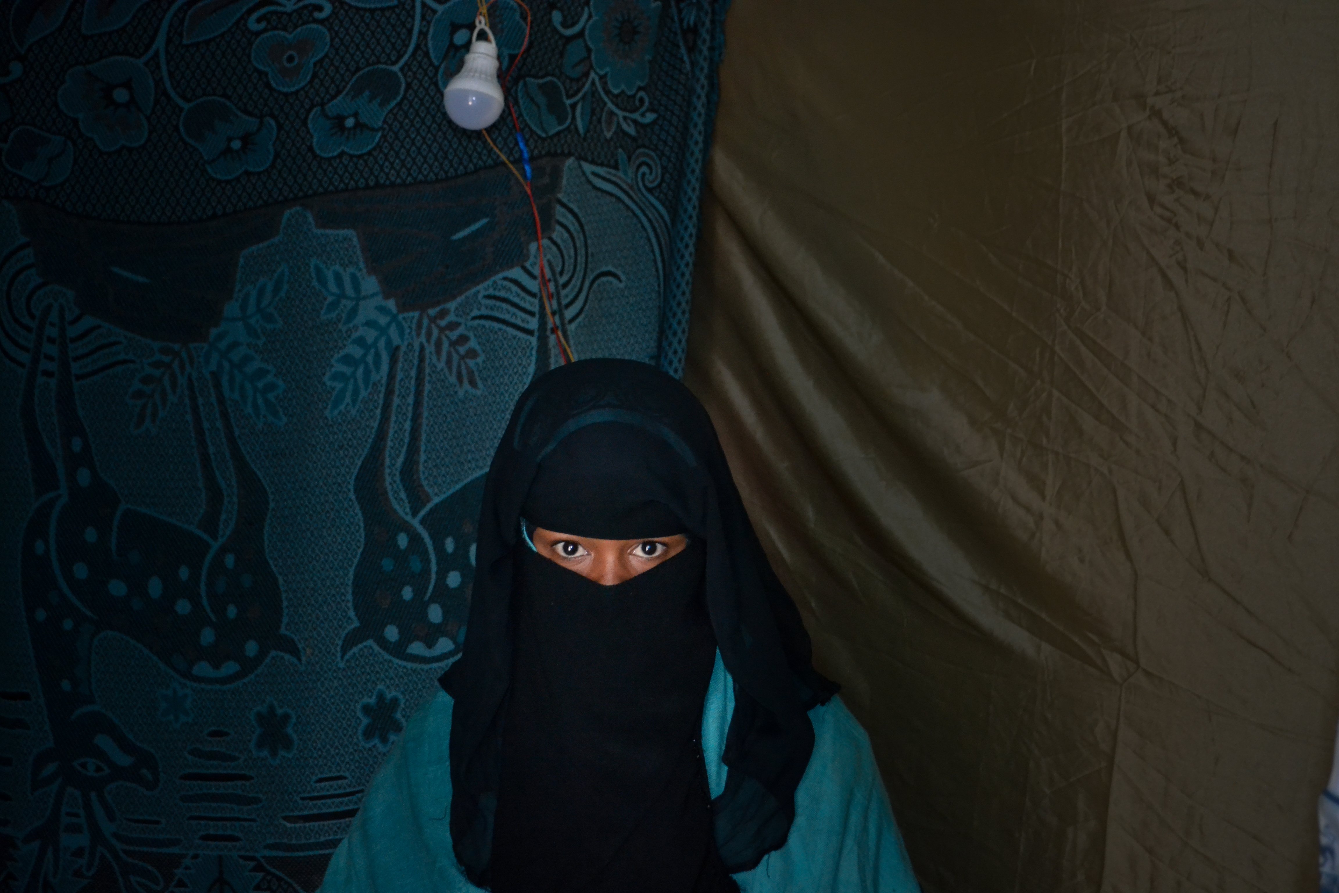 Girl wearing black niqab