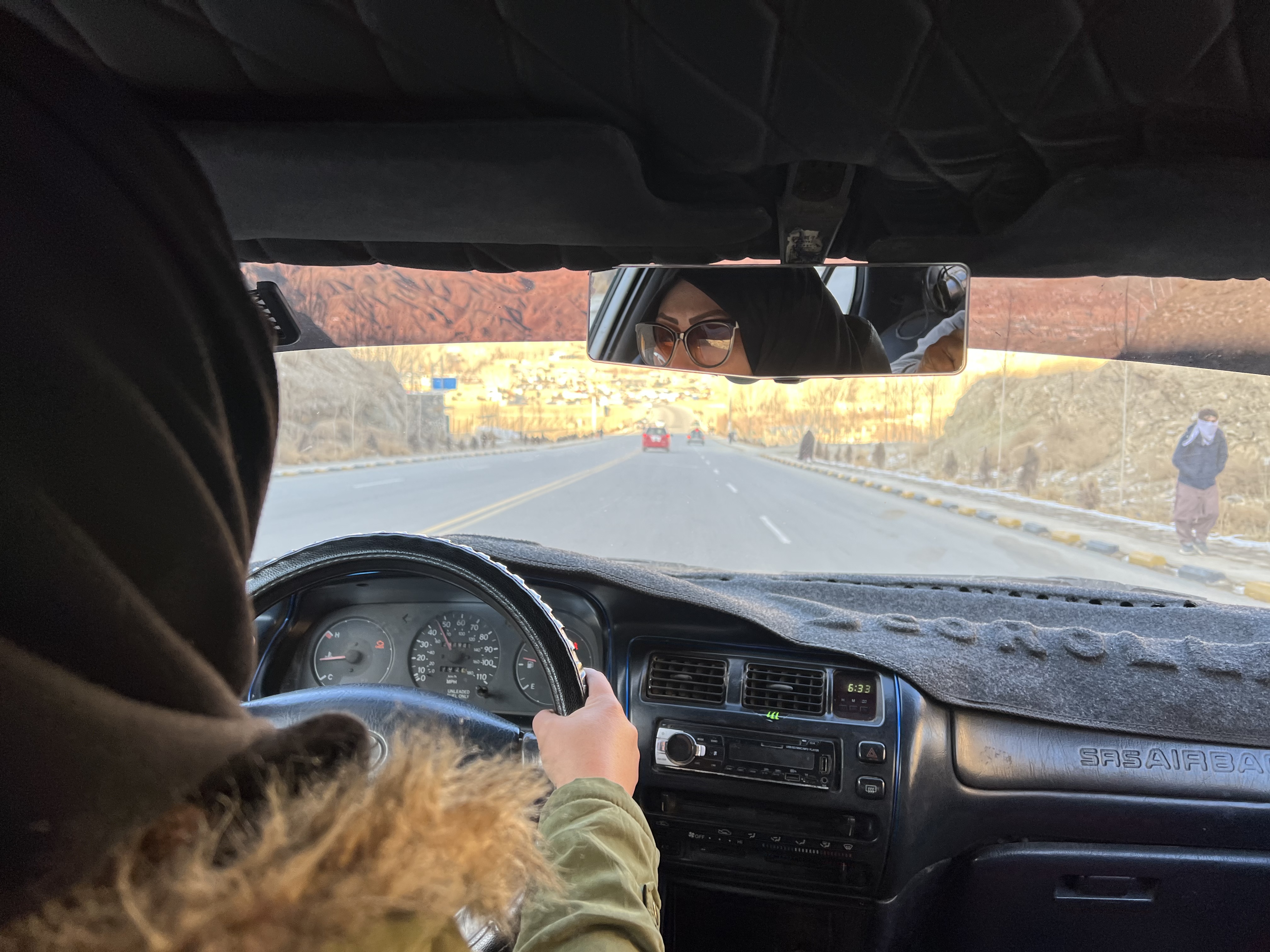 Aaila, 37, drives around Bamiyan in her white Toyota. When the Taliban returned to power in Afghanistan in August 2021, Aaila took to the streets in her car. She says she wanted to show that she would continue to stand up for her rights.