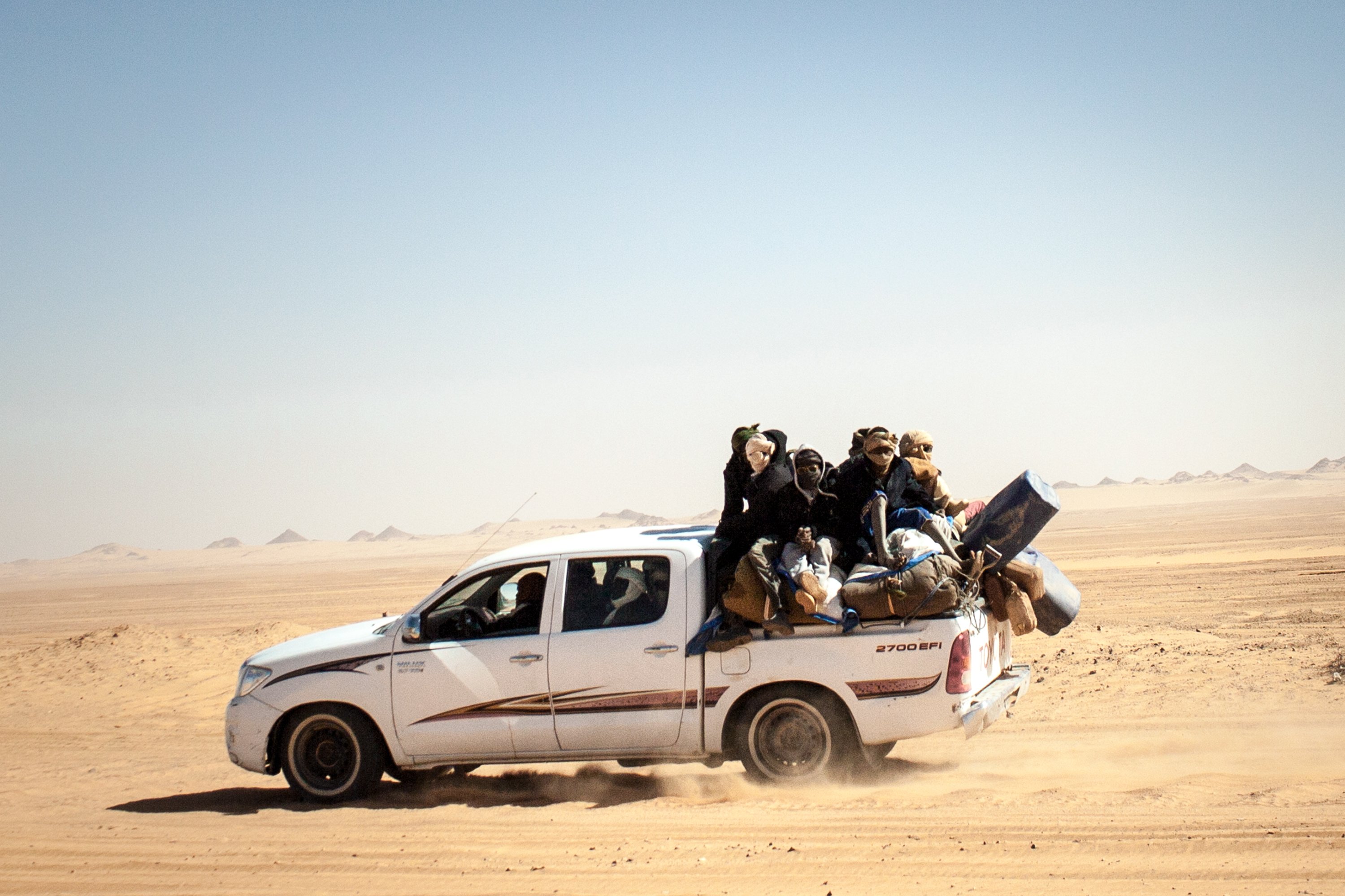 Men in the back of a truck