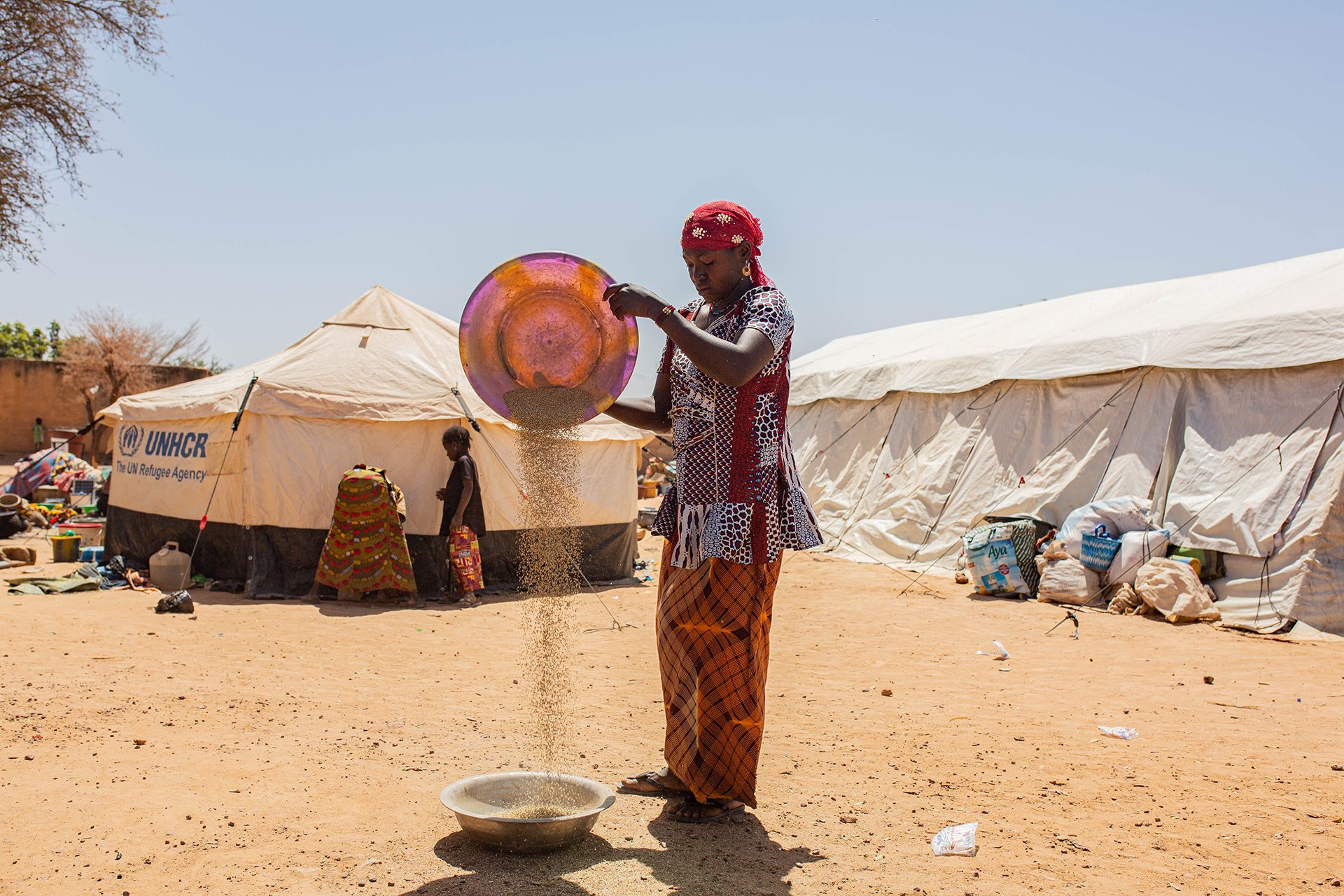 A woman prepares food at a displacement camp in central Mali’s Bandiagara region.