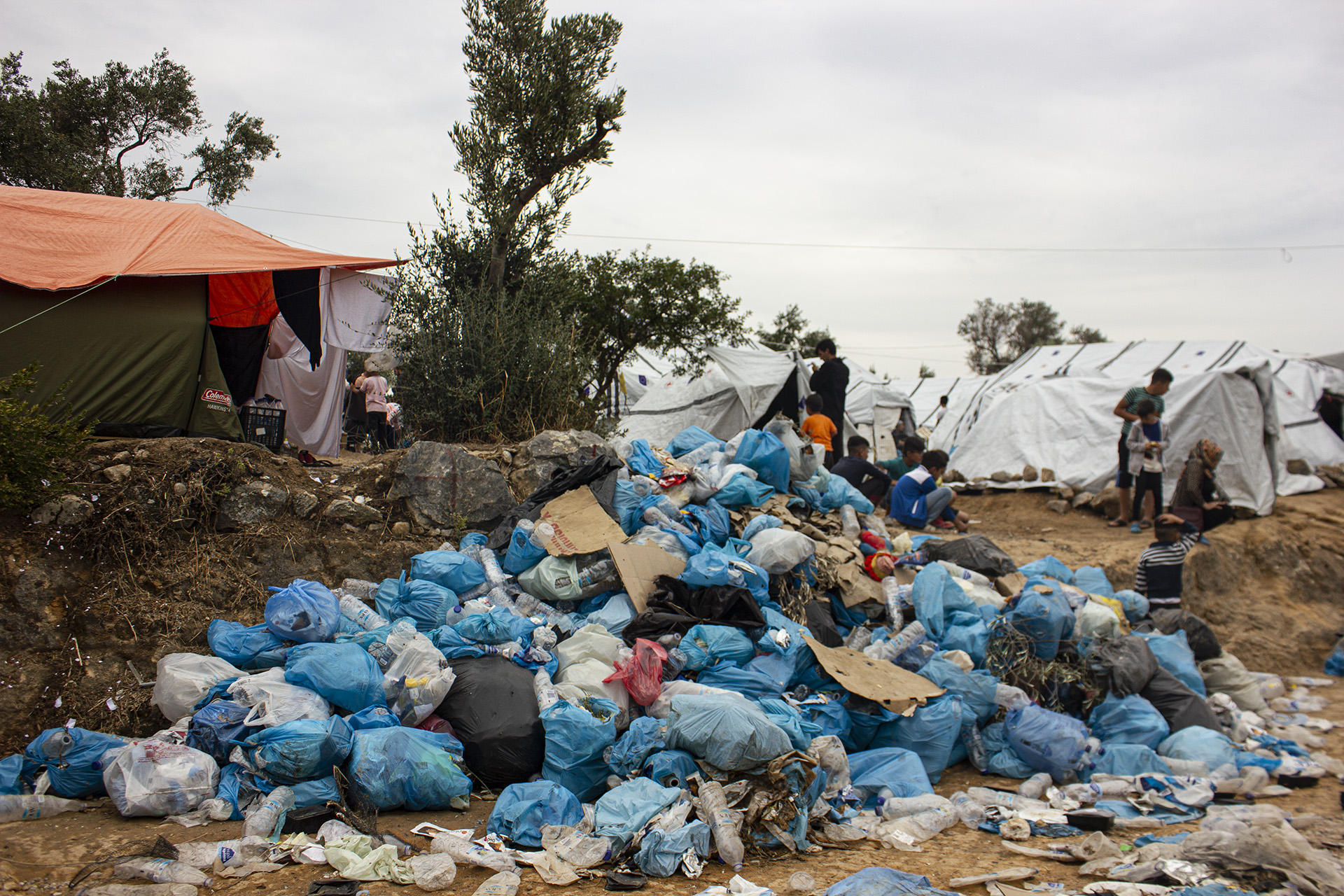 Garbage piled up along a road in Moria refugee camp.