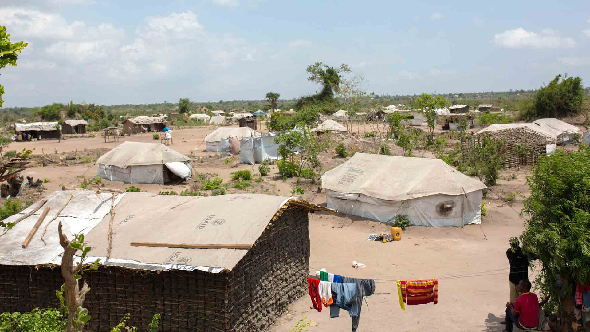 At Mutua resettlement site, most residents are still living in worn-looking shelters as the rainy season arrives.