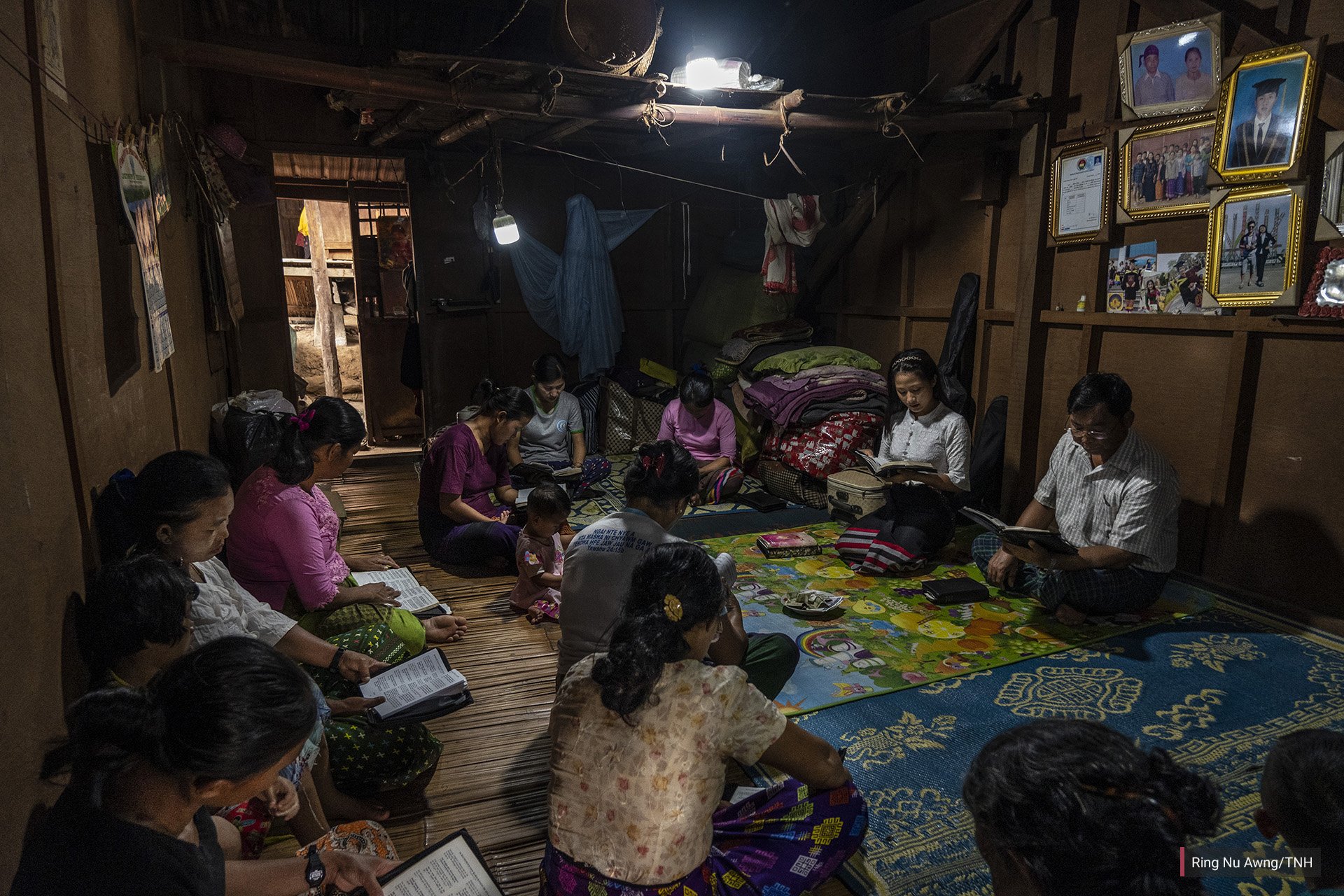 Women gather to pray in a shelter in Je Yang