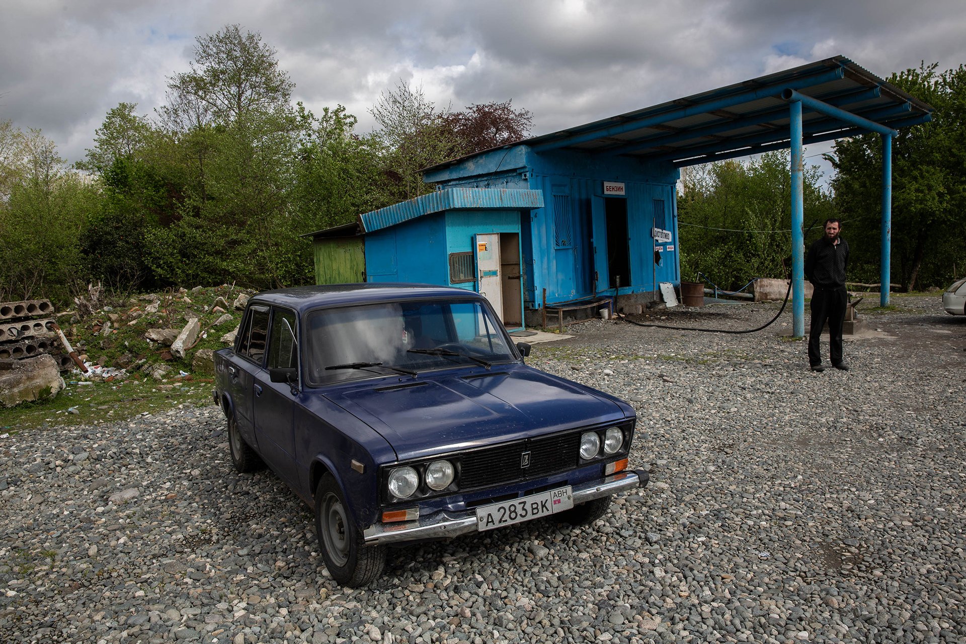 An old Soviet car sits in front of a refueling station near Labra, Abkhazia on 20 April 2019.