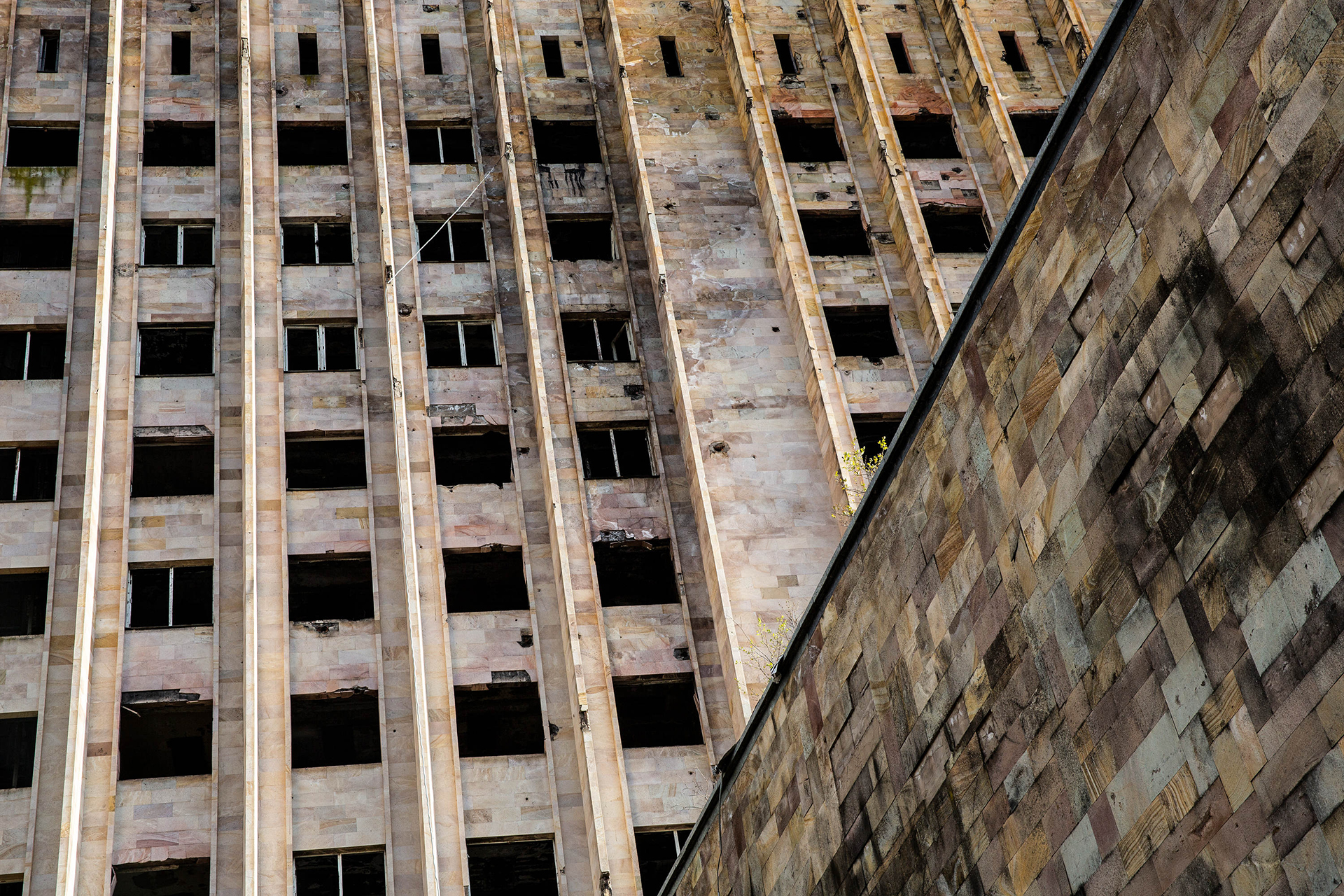 Close up photo at jaunting angles of a derelict building in Sukhumi, Abkhazia