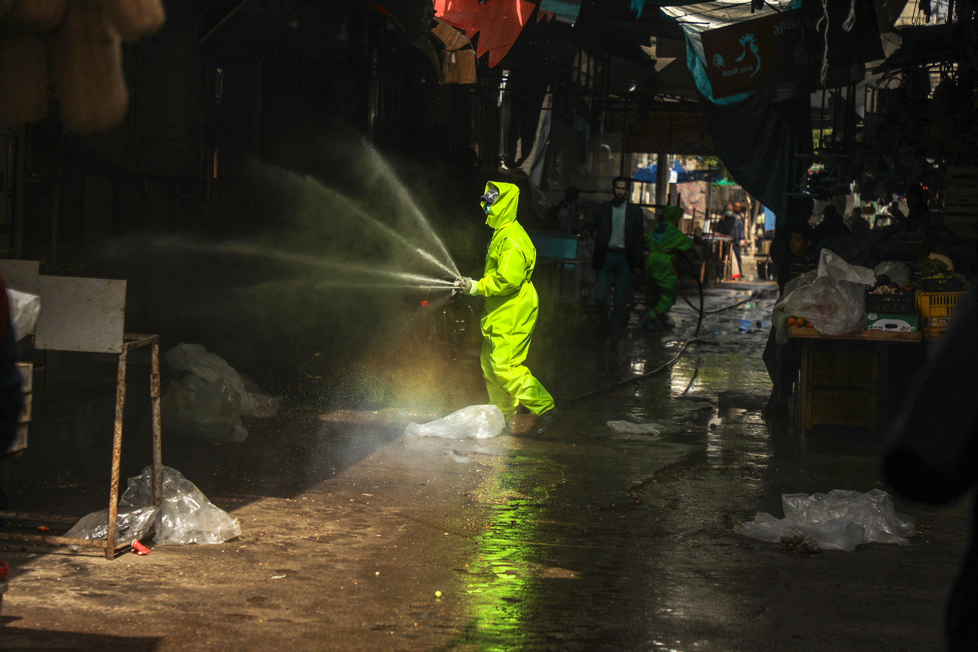 A worker sprays disinfectant at Gaza’s al-Shati camp