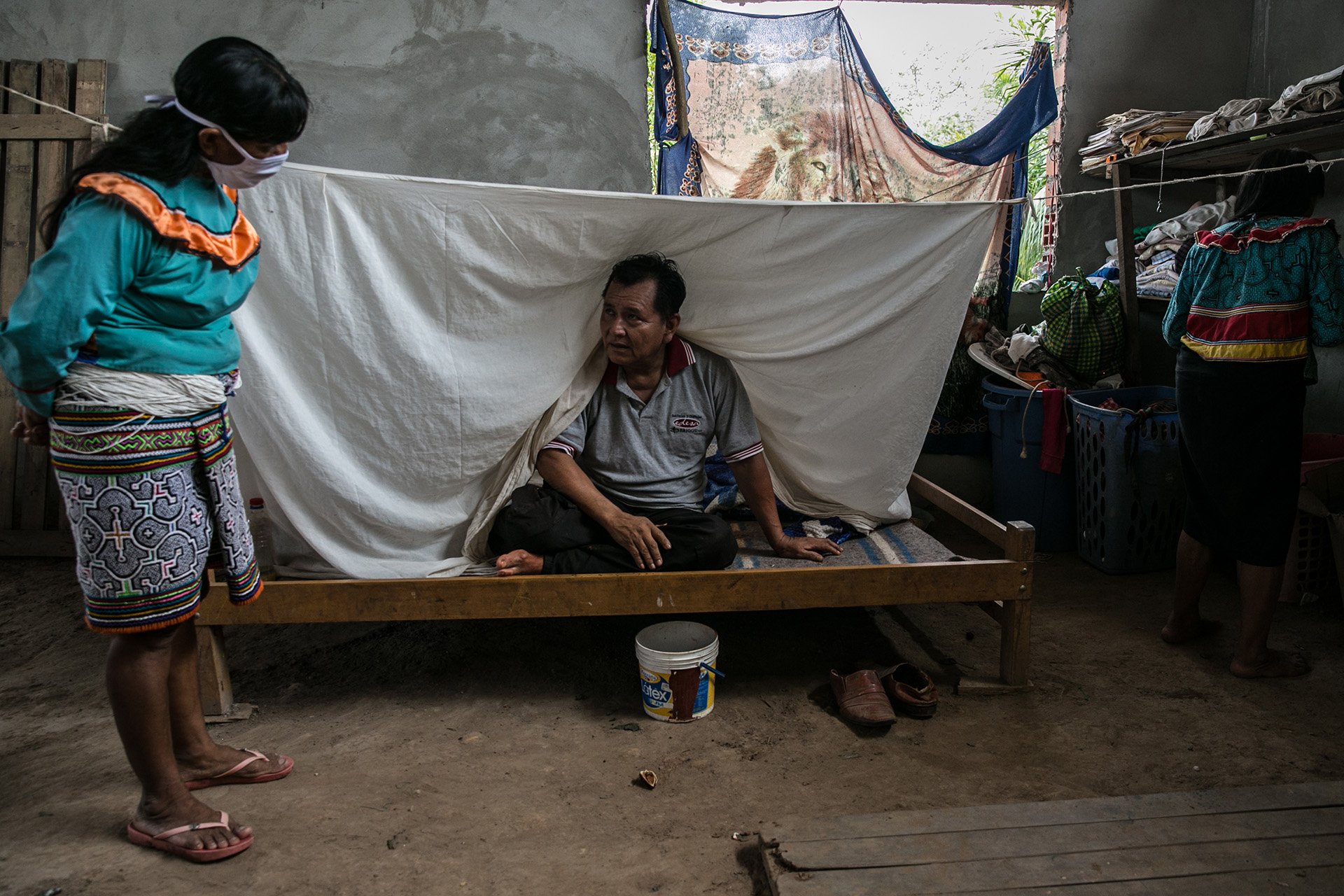 Carmen Bardalez, 54, checks on a patient