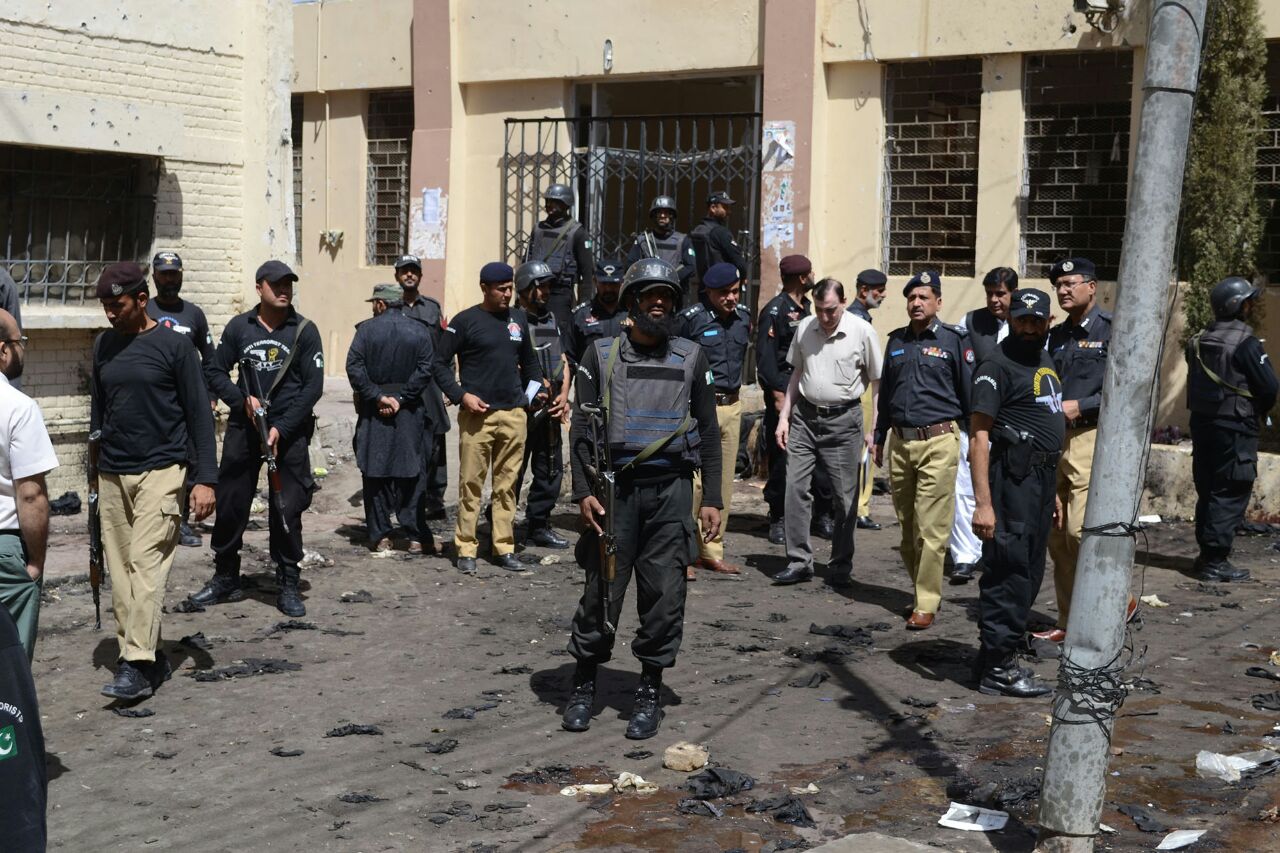 Police at the scene of the August bombing of a hospital in Quetta