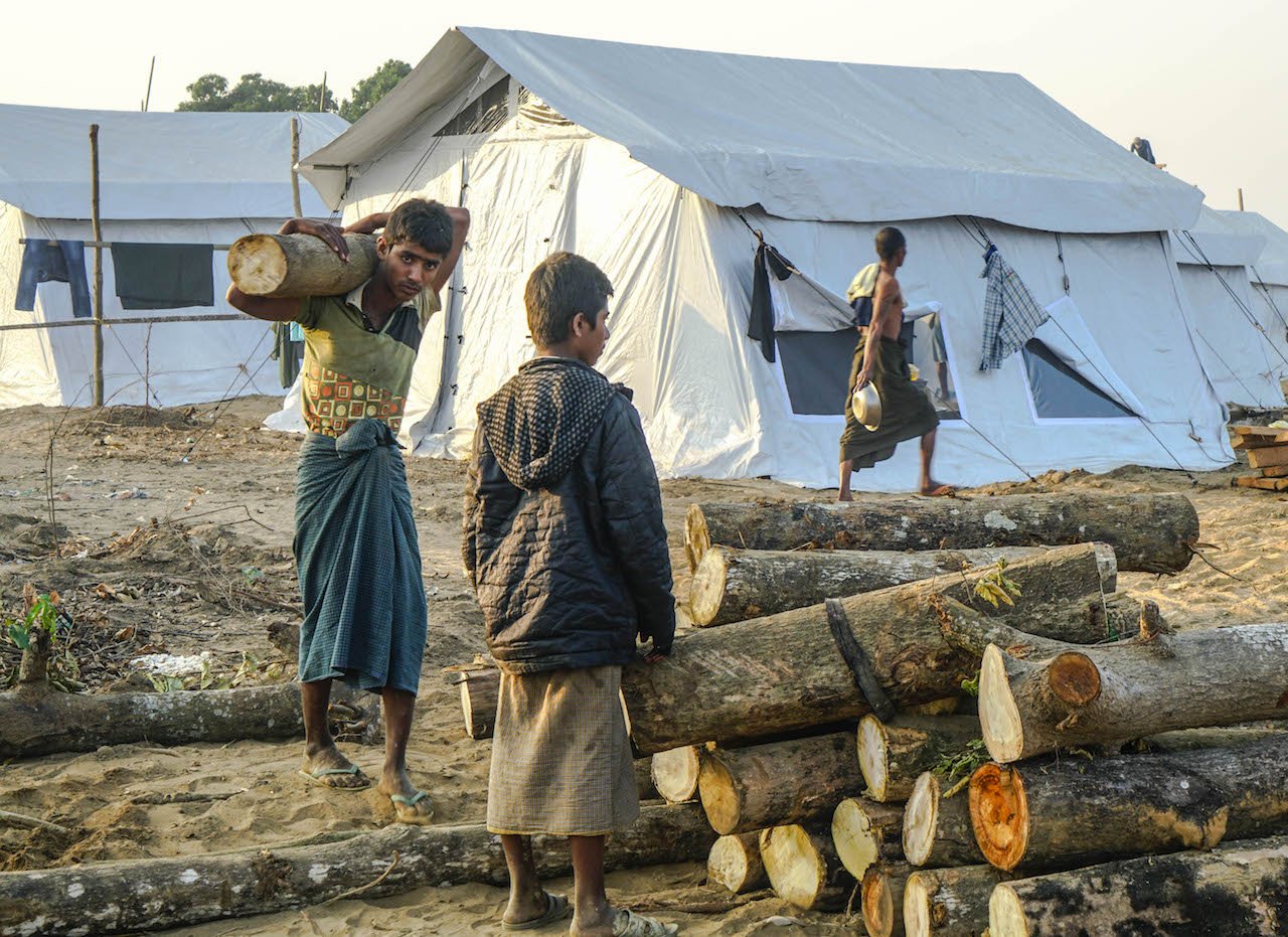 Labourers work at a new construction site near Hla Poe Kaung village in Myanmar’s northern Rakhine State in late January 2018.