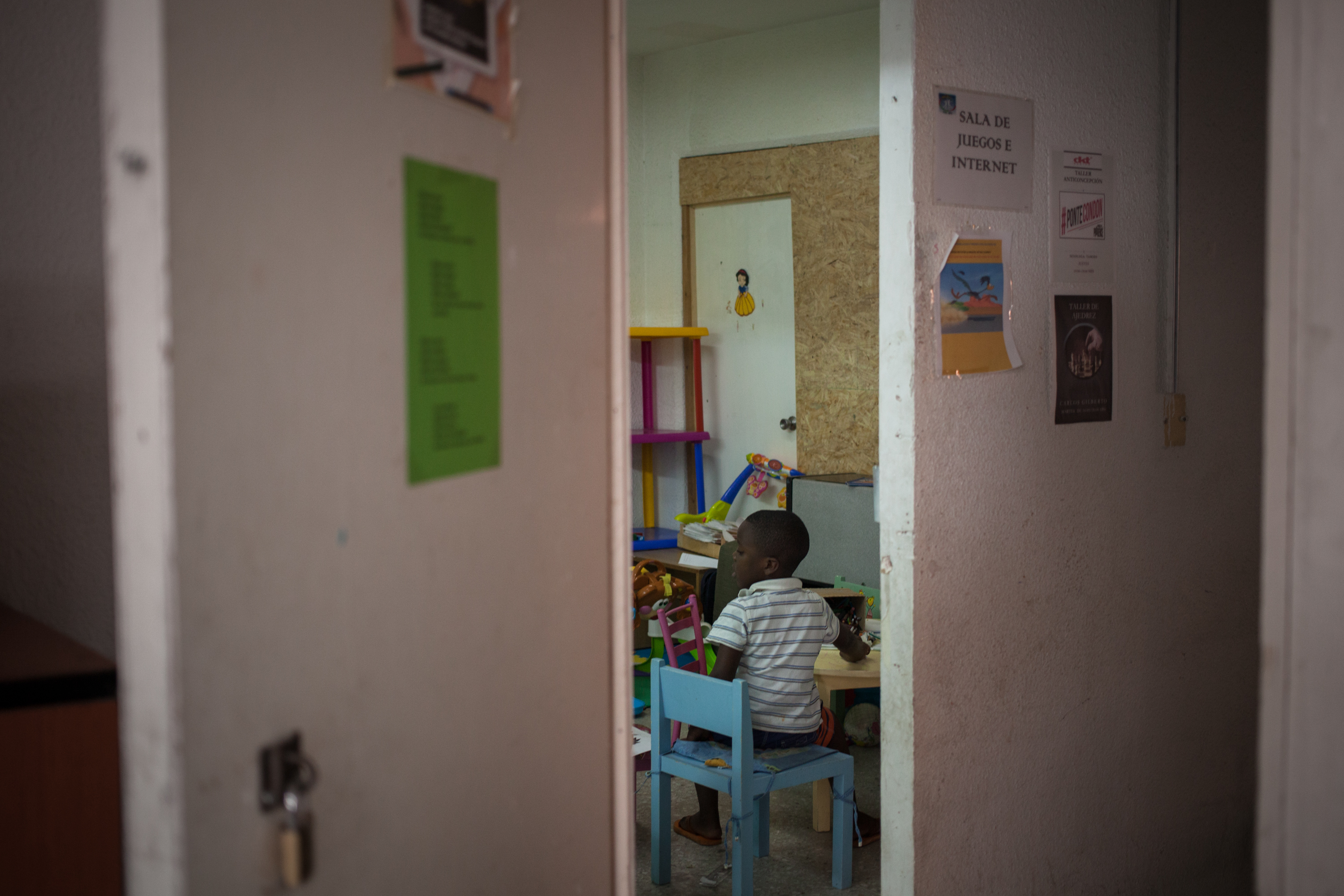 A boy plays at a shelter for migrants and refugees in Mexico City