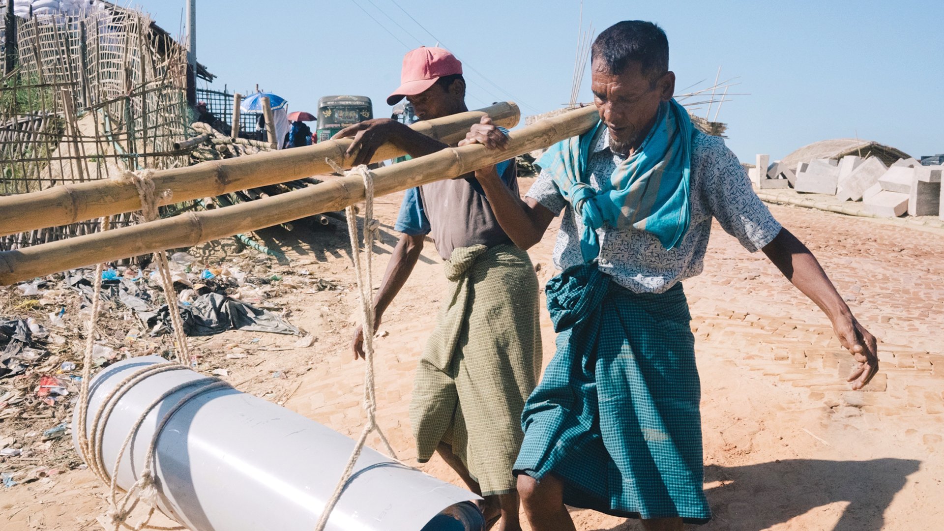 Rohingya men help to transport material and carry out manual labour on infrastructure projects in exchange for daily stipends.