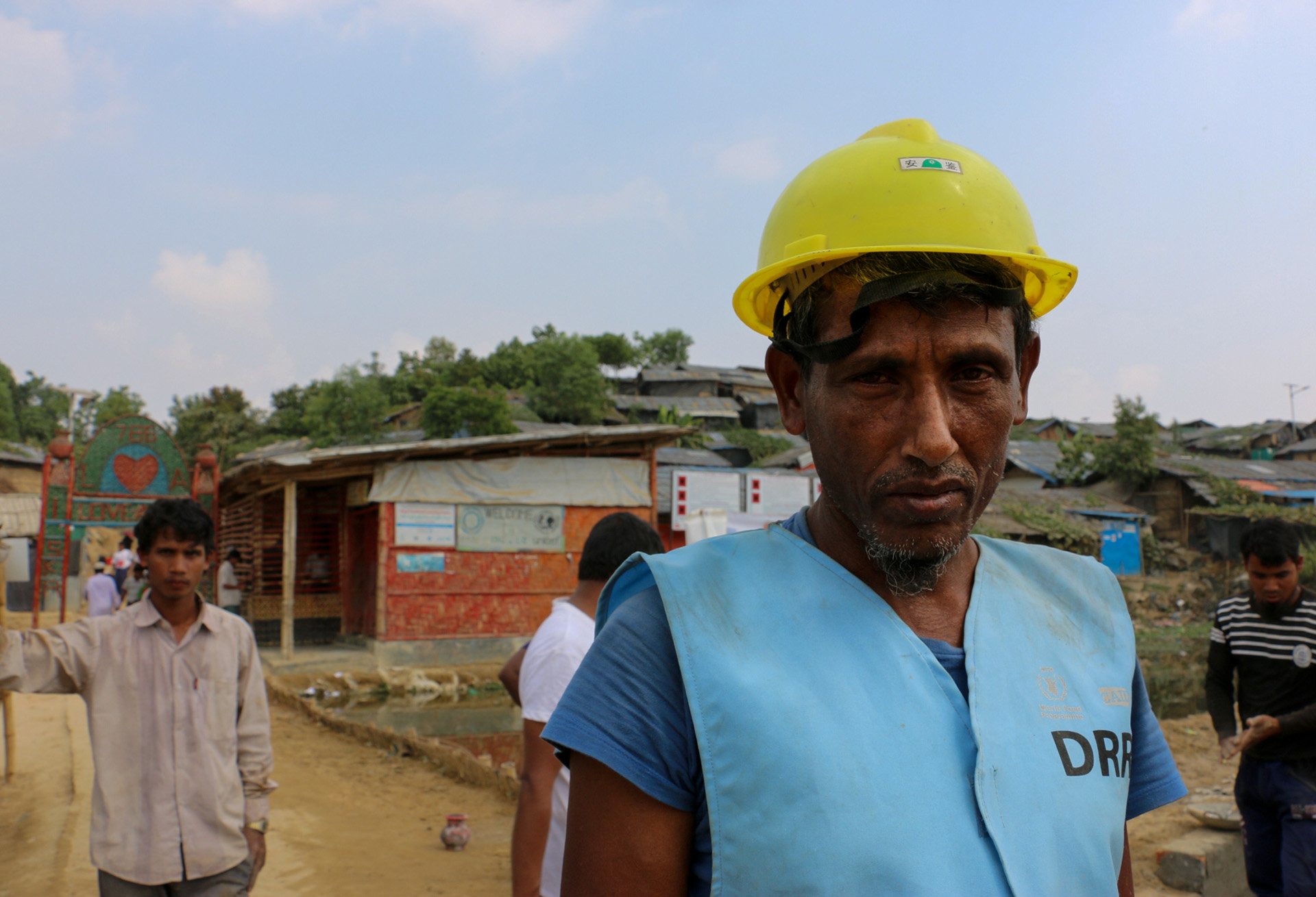 A man in a hard hat and vest