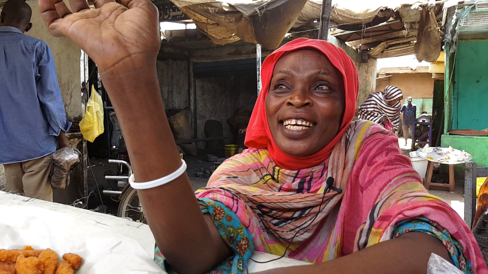 A Sudanese woman sells falafel