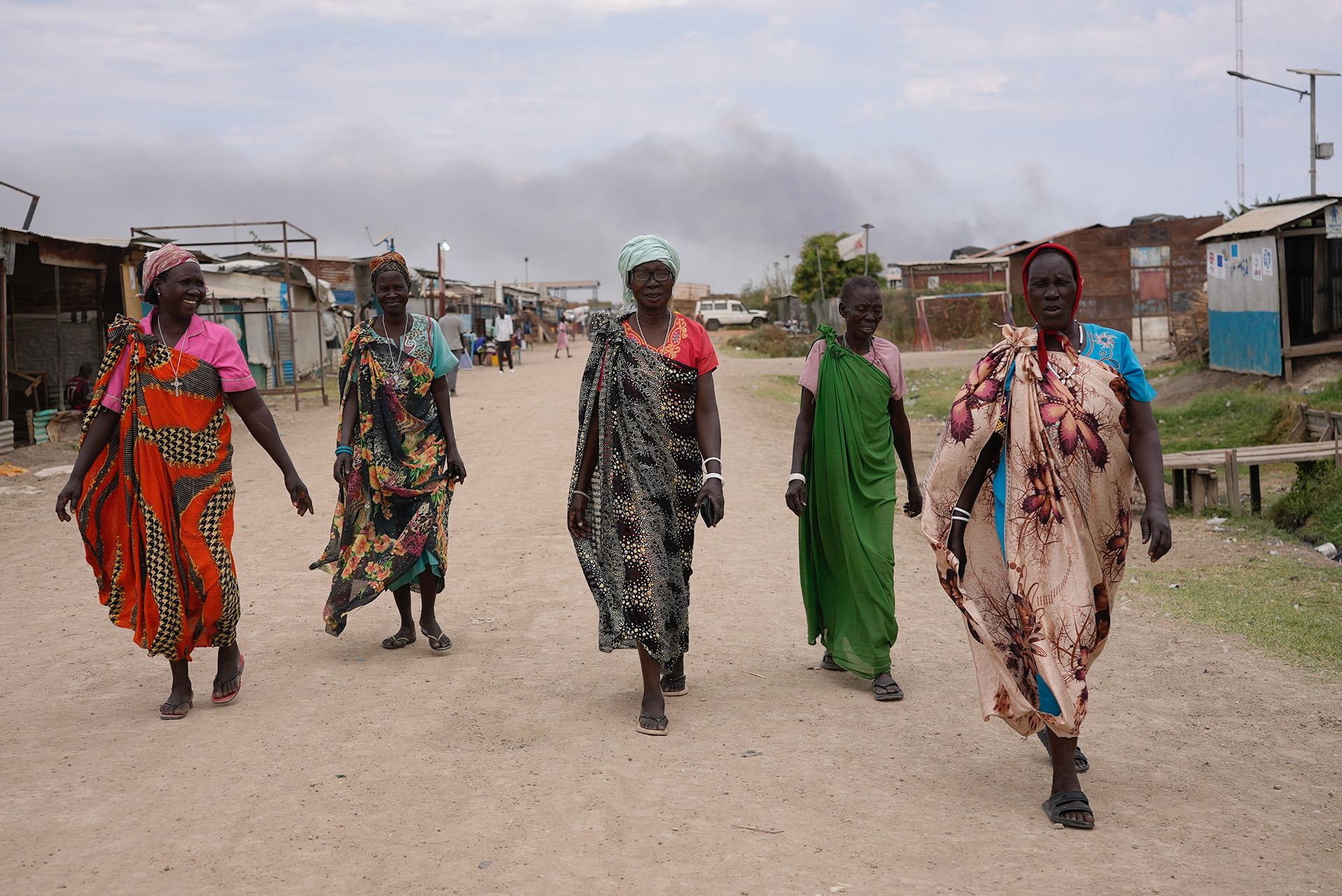 A group of women walking through the UN-run protection of civilian site in Malakal. A group of women walking through the UN-run protection of civilian site in Malakal.