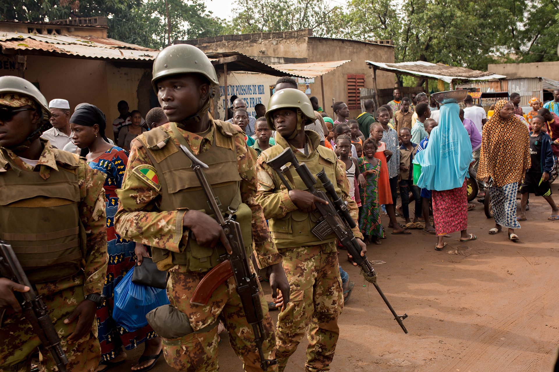 Armed guards watch over a polling station