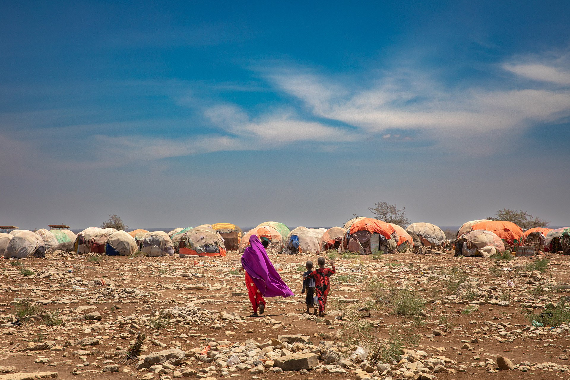 People fleeing drought and conflict arrive in sprawling settlements on the outskirts of towns like Baidoa, in south-central Somalia, in August 2022.